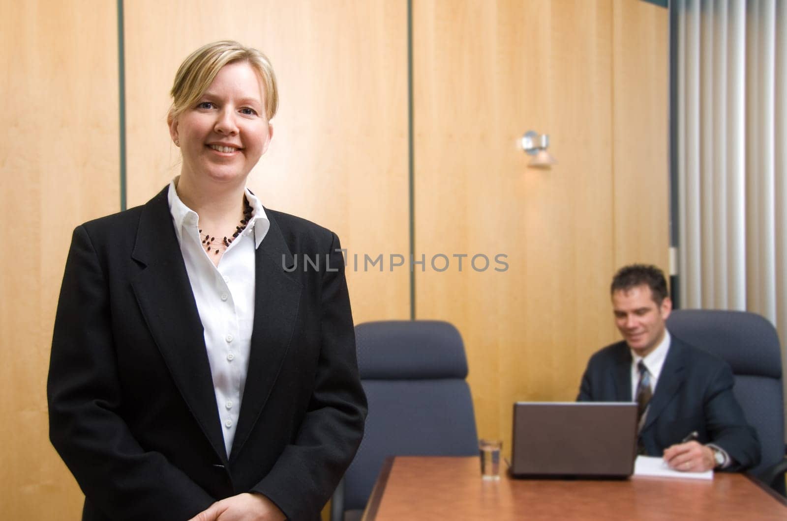 2 business people with woman in foreground