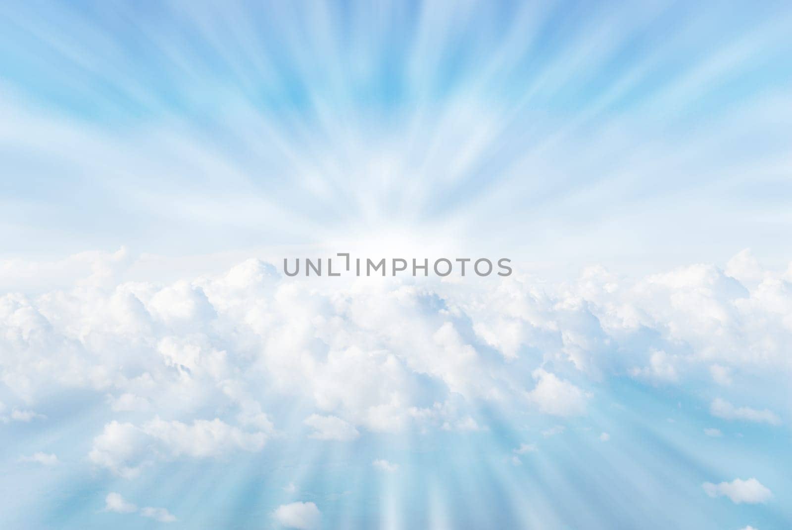 white fluffy coulds from heaven sun rays