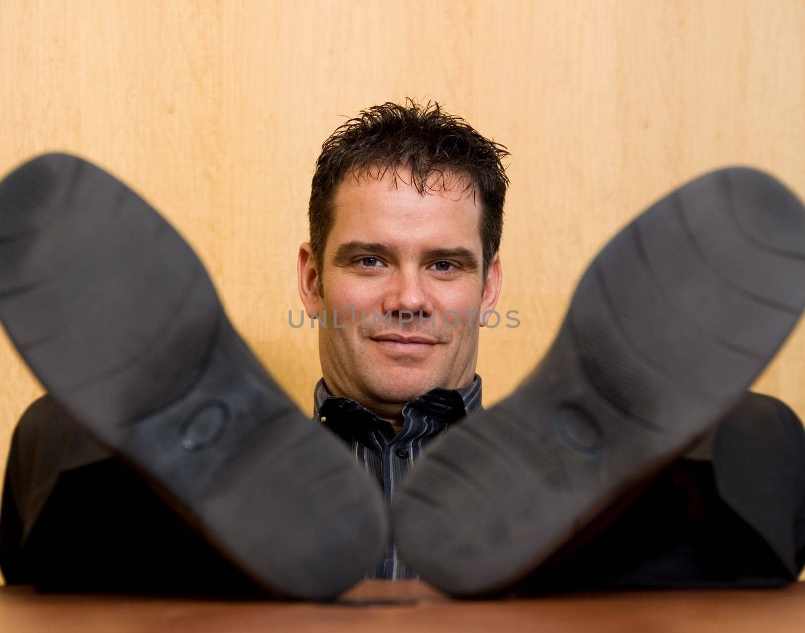 business man with his feet on the desk