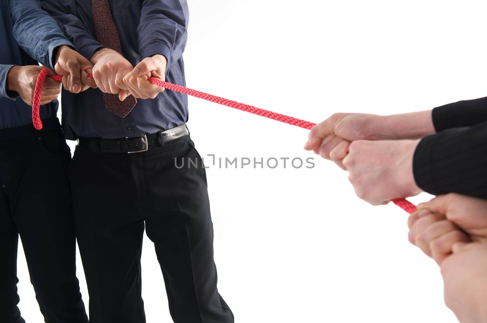 Business team pulling to win on isolated white