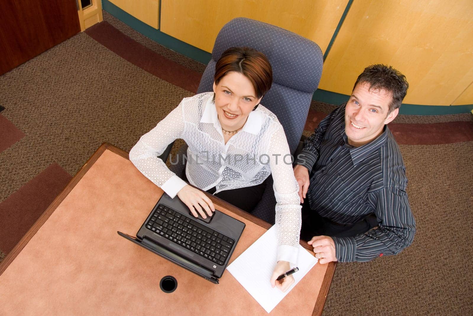 two business colleagues in a boardroom in a meeting