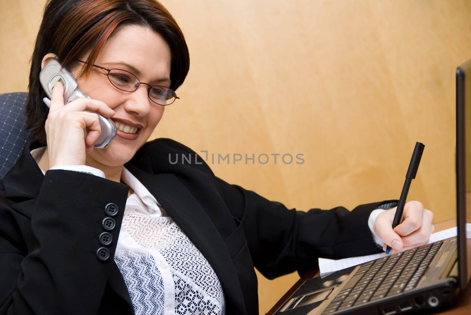 happy cute woman on the phone in a meeting