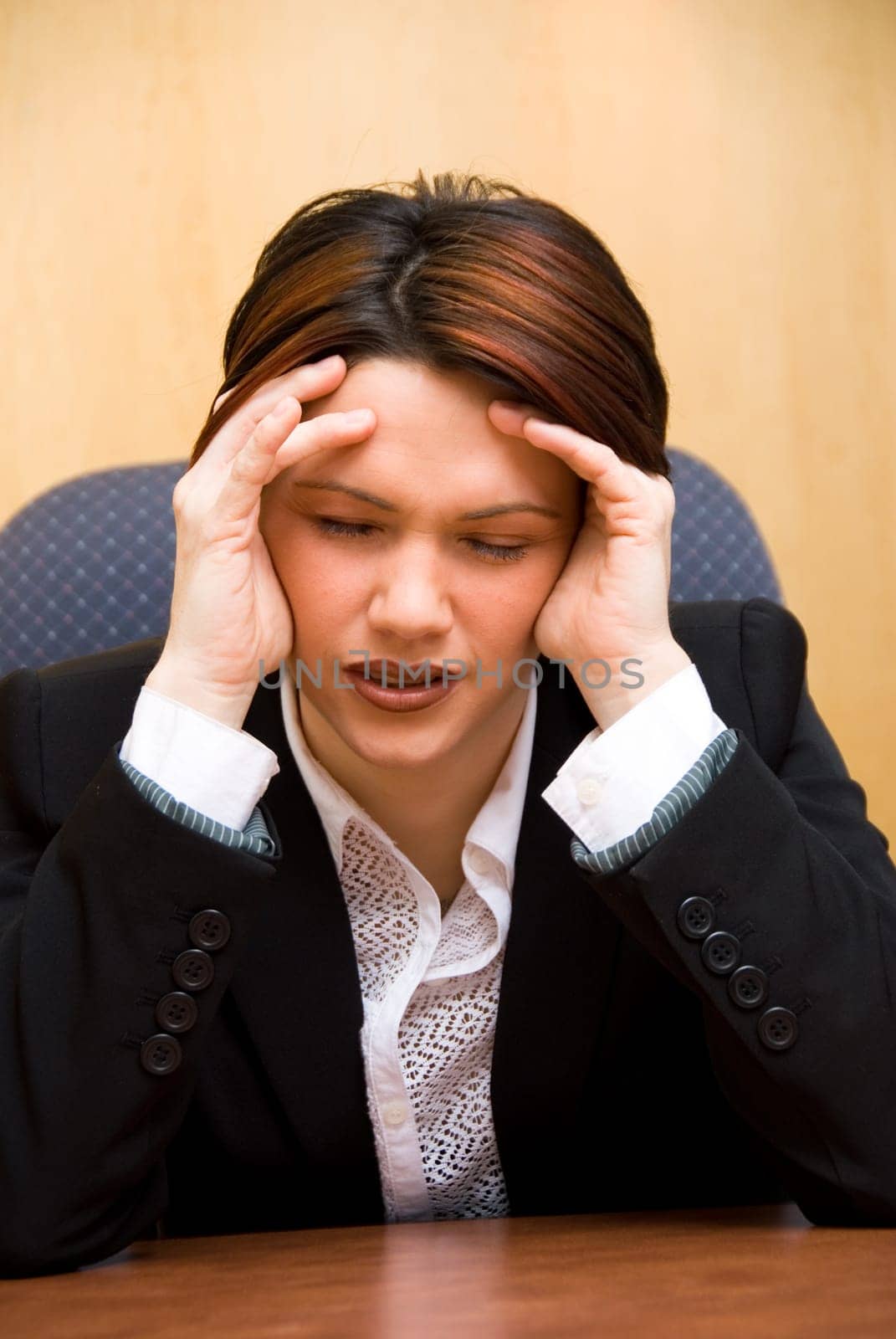 burnout woman at her work holding her head