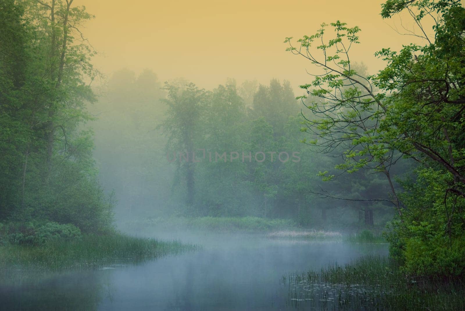 morning misty riverwith orange and blue hues