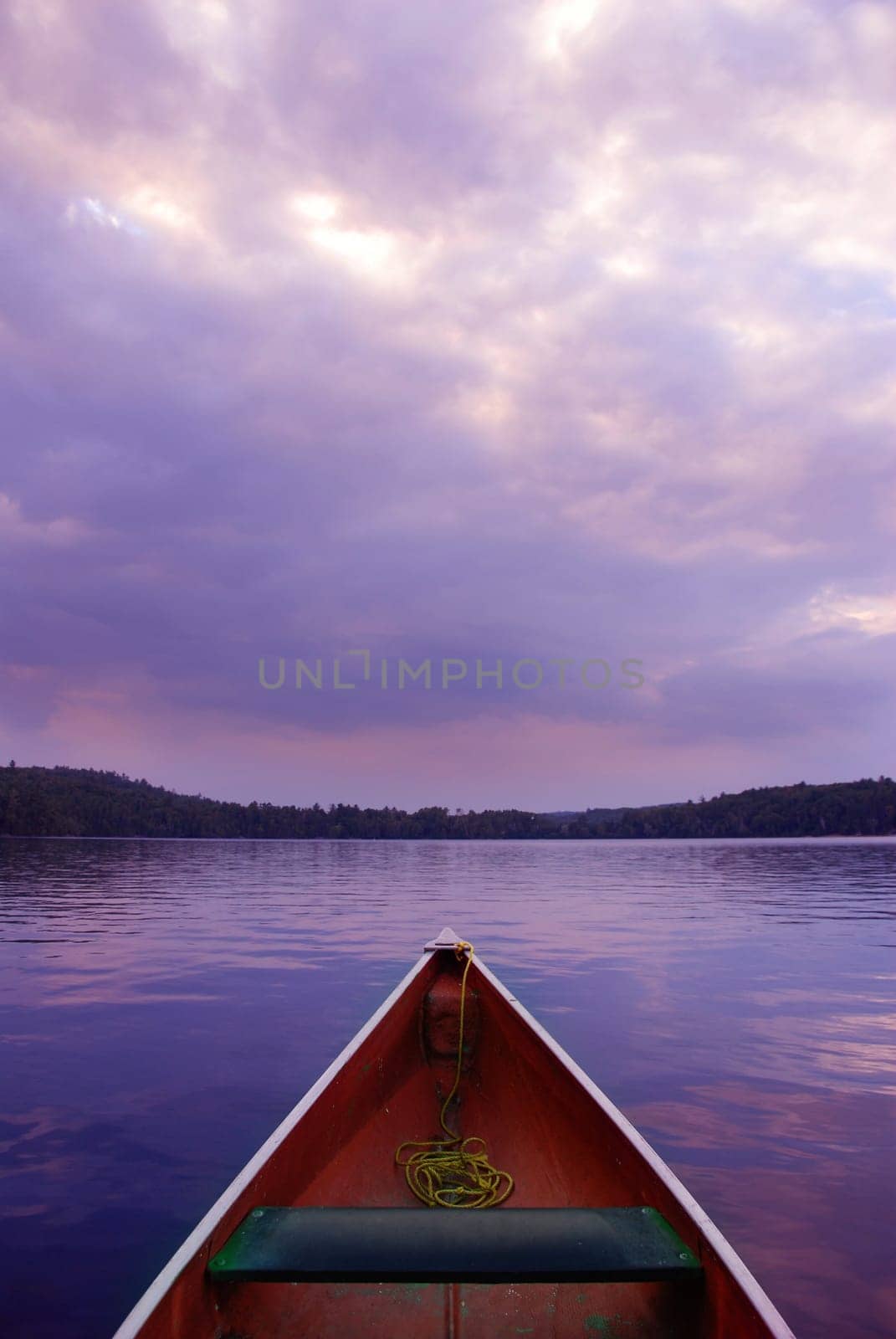 boat at sunset on lake
