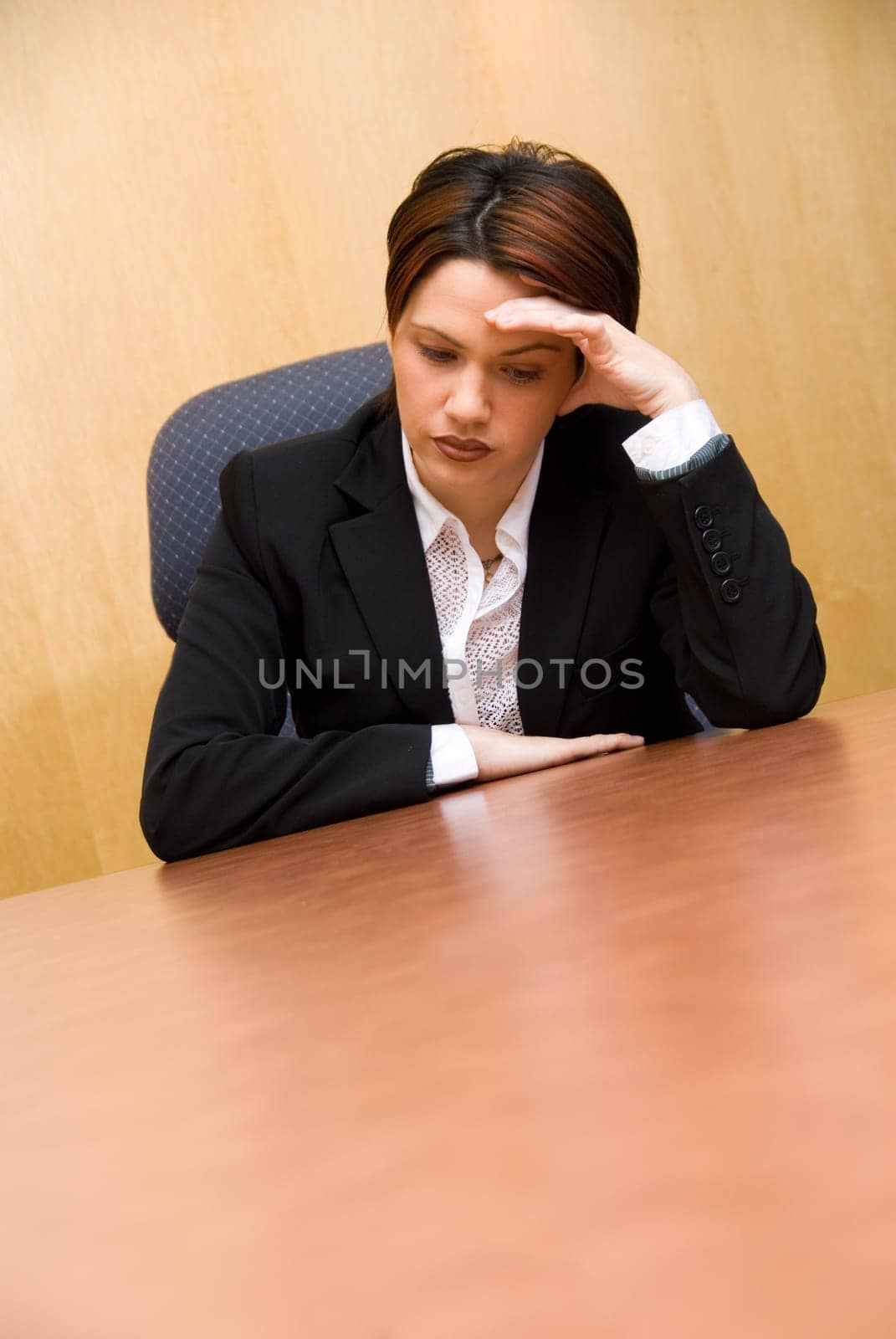 sad cute woman at the office at her desk