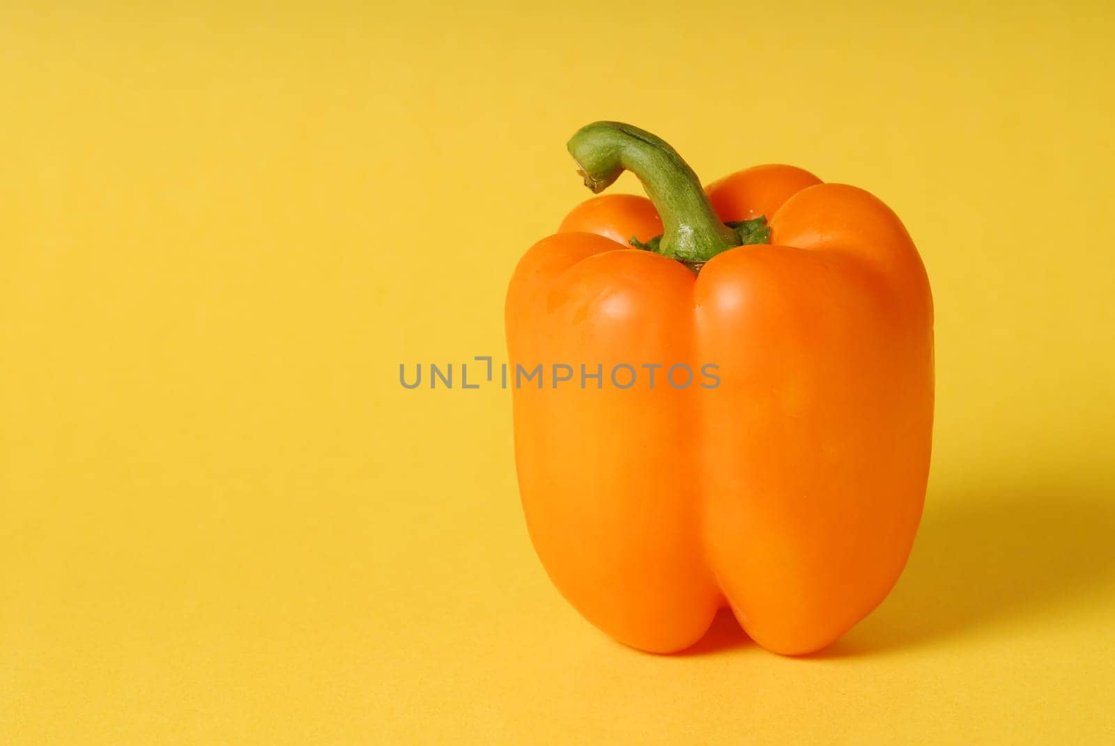 orange pepper on background