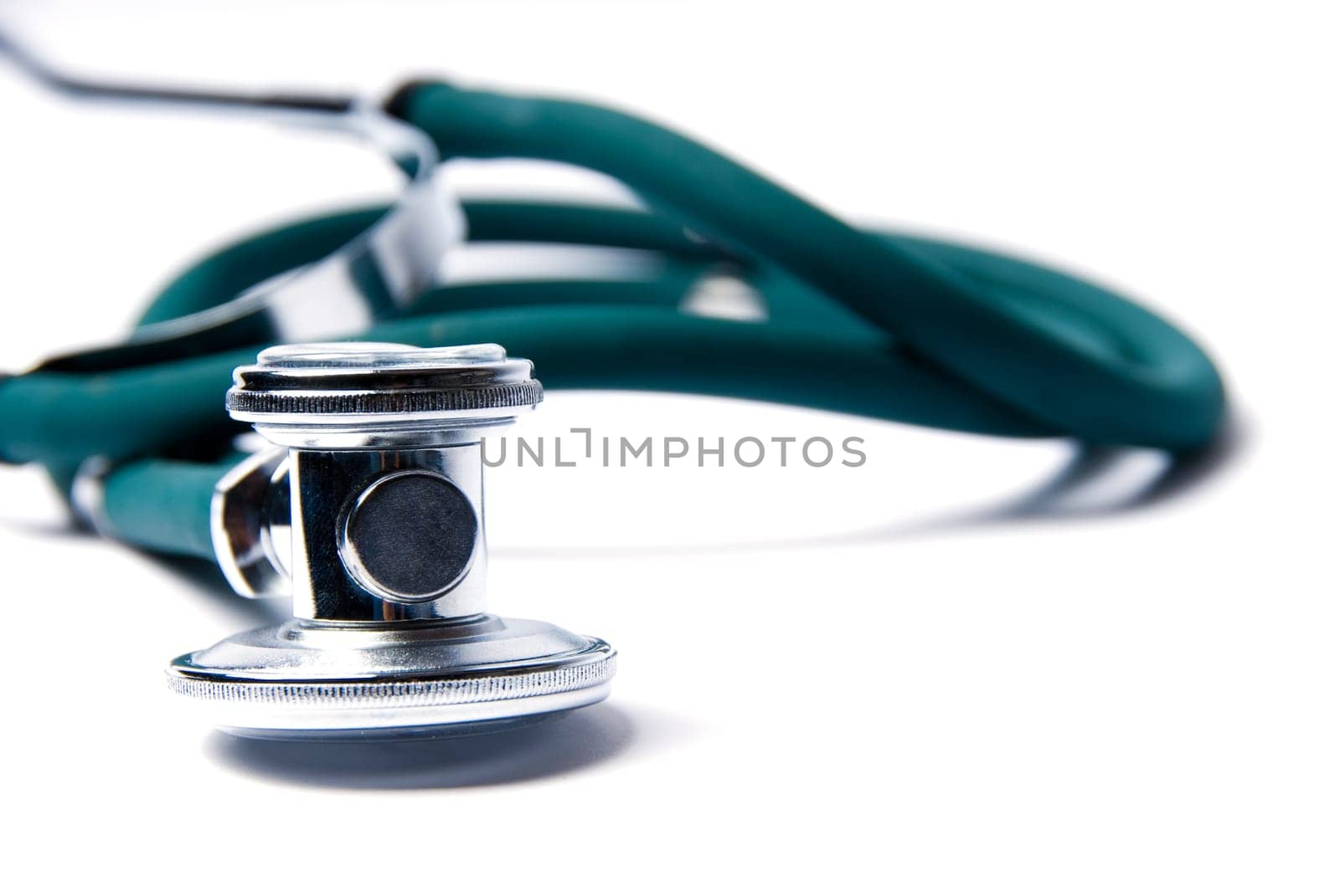 Stethoscope in green on an isolated white background