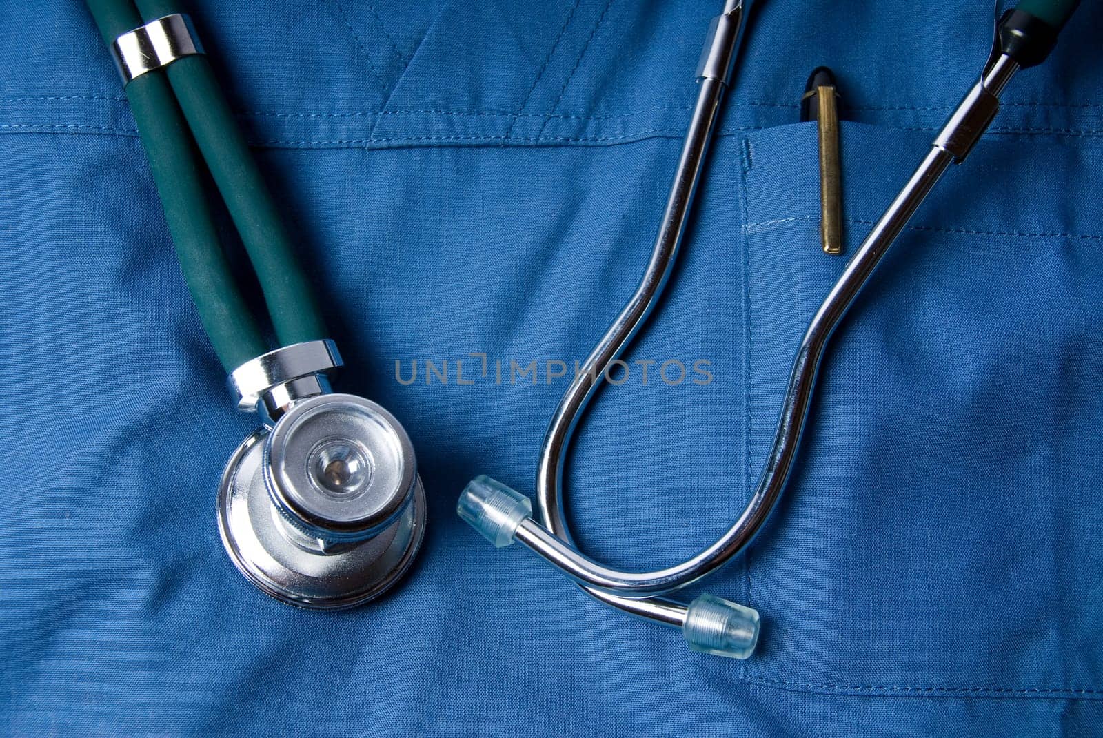 Stethoscope in green with some blue scrubs