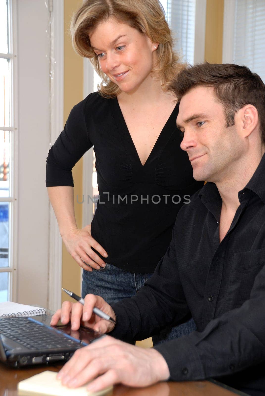 couple at home on the laptop on the table