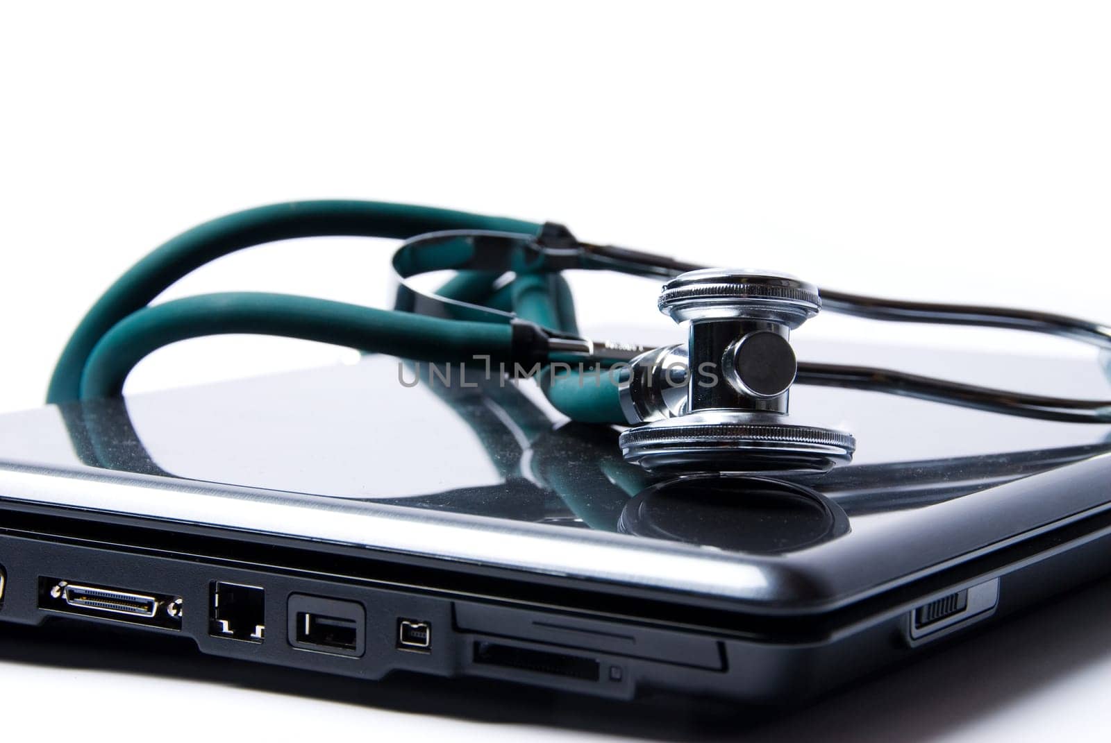 Stethoscope and laptop isolated on white backgound