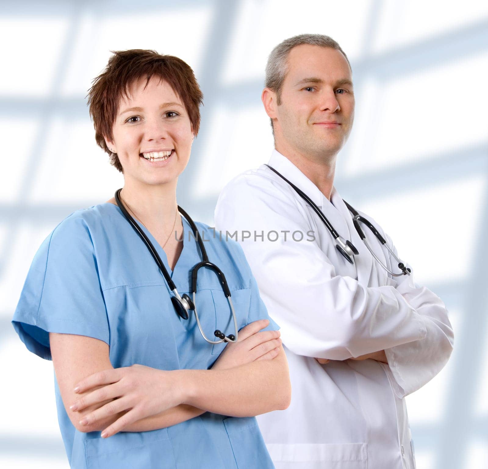 happy male doctor in lab coat on white