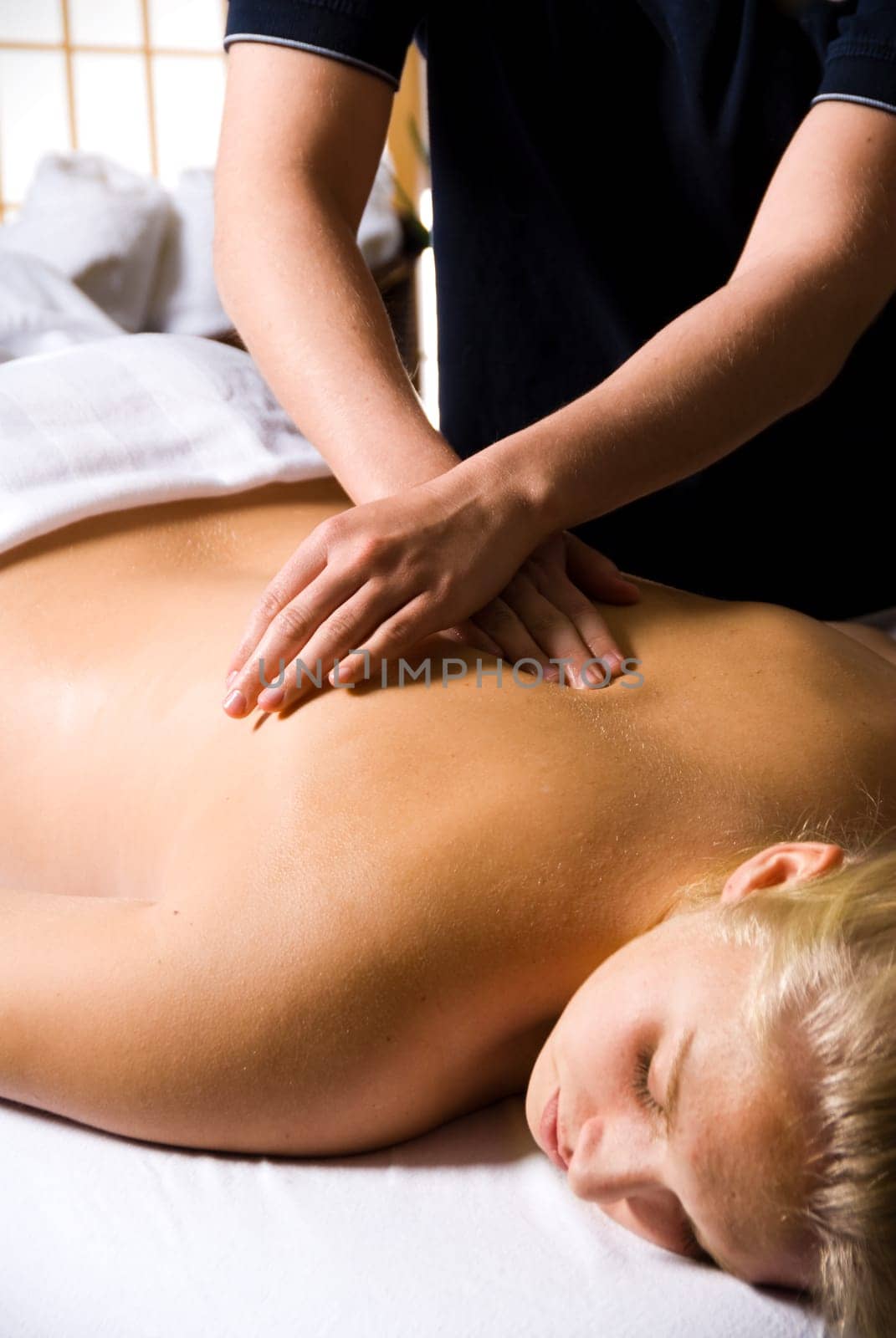 woman getting a good massage at a day spa