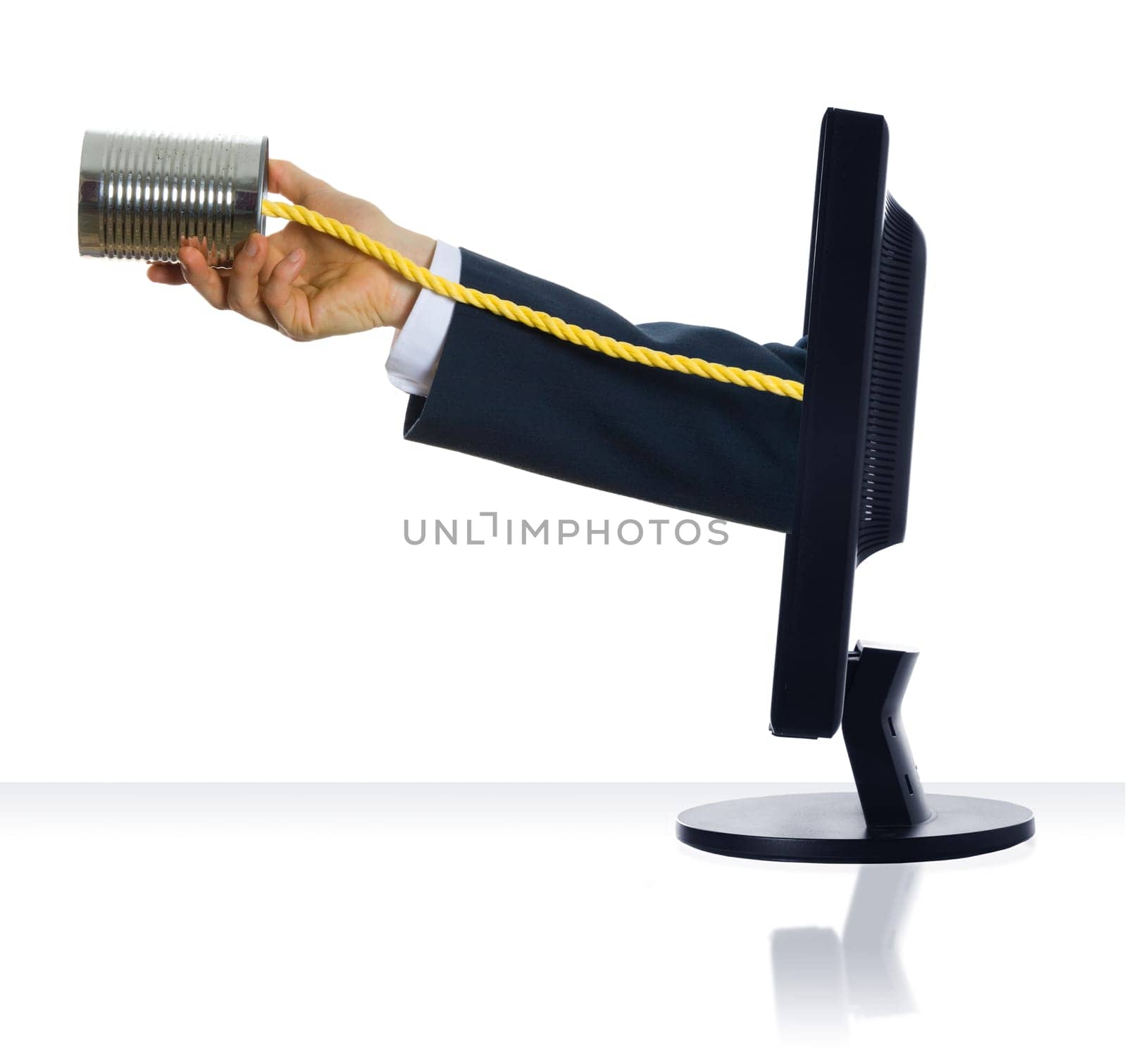 A hand holding a tin can phone from a monitor