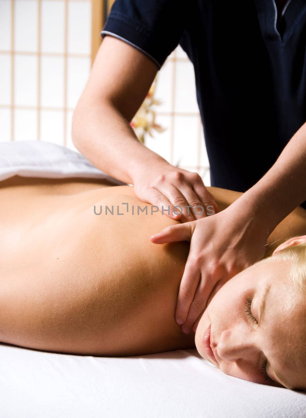 woman getting a good massage at a day spa