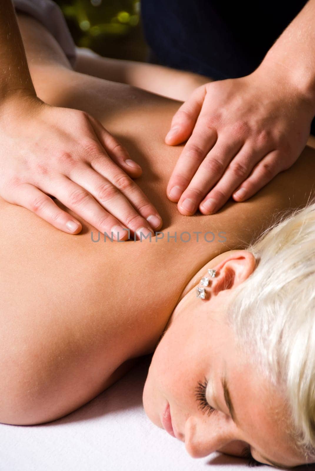 woman getting a good massage at a day spa