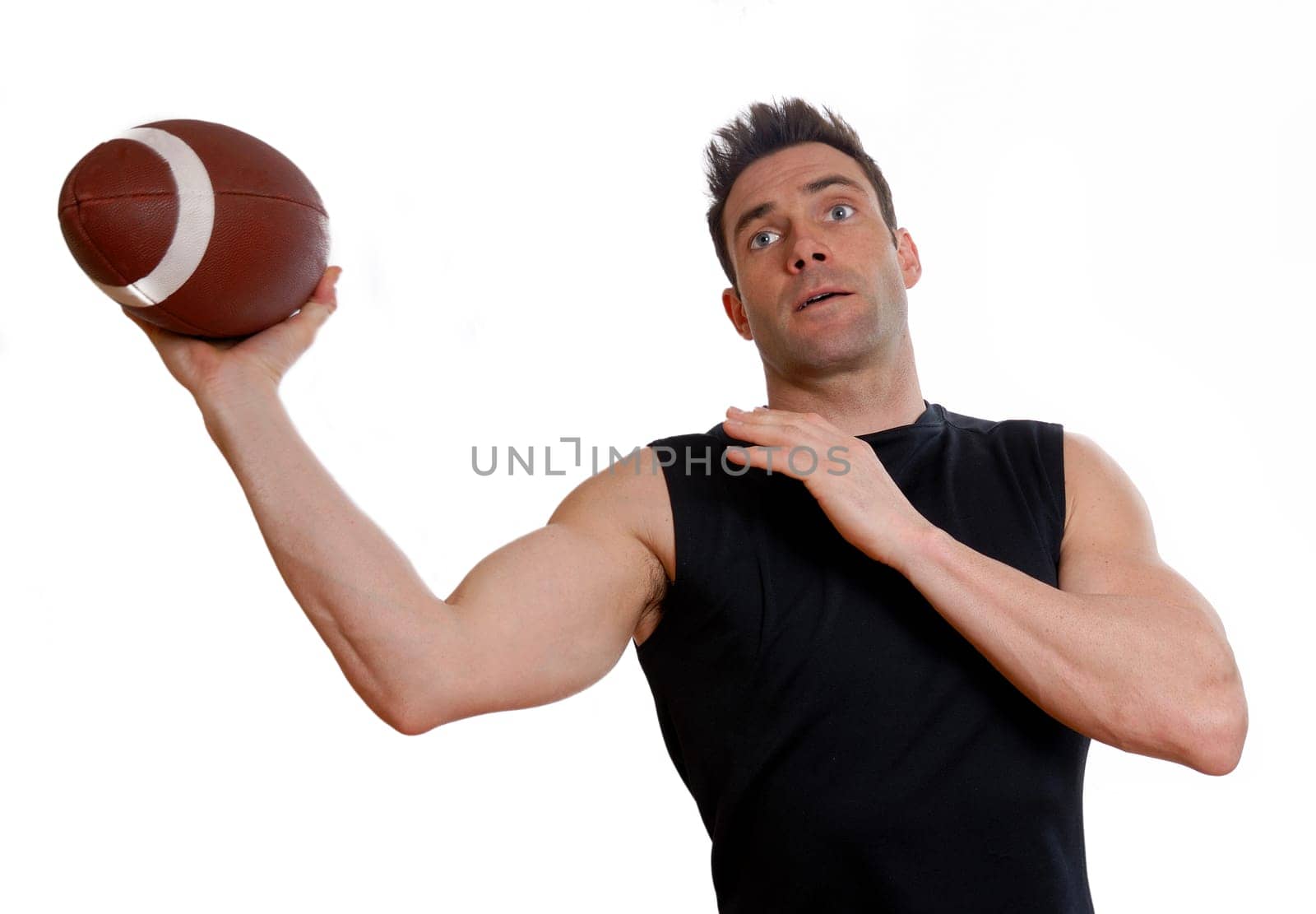 man in black top throwing a football