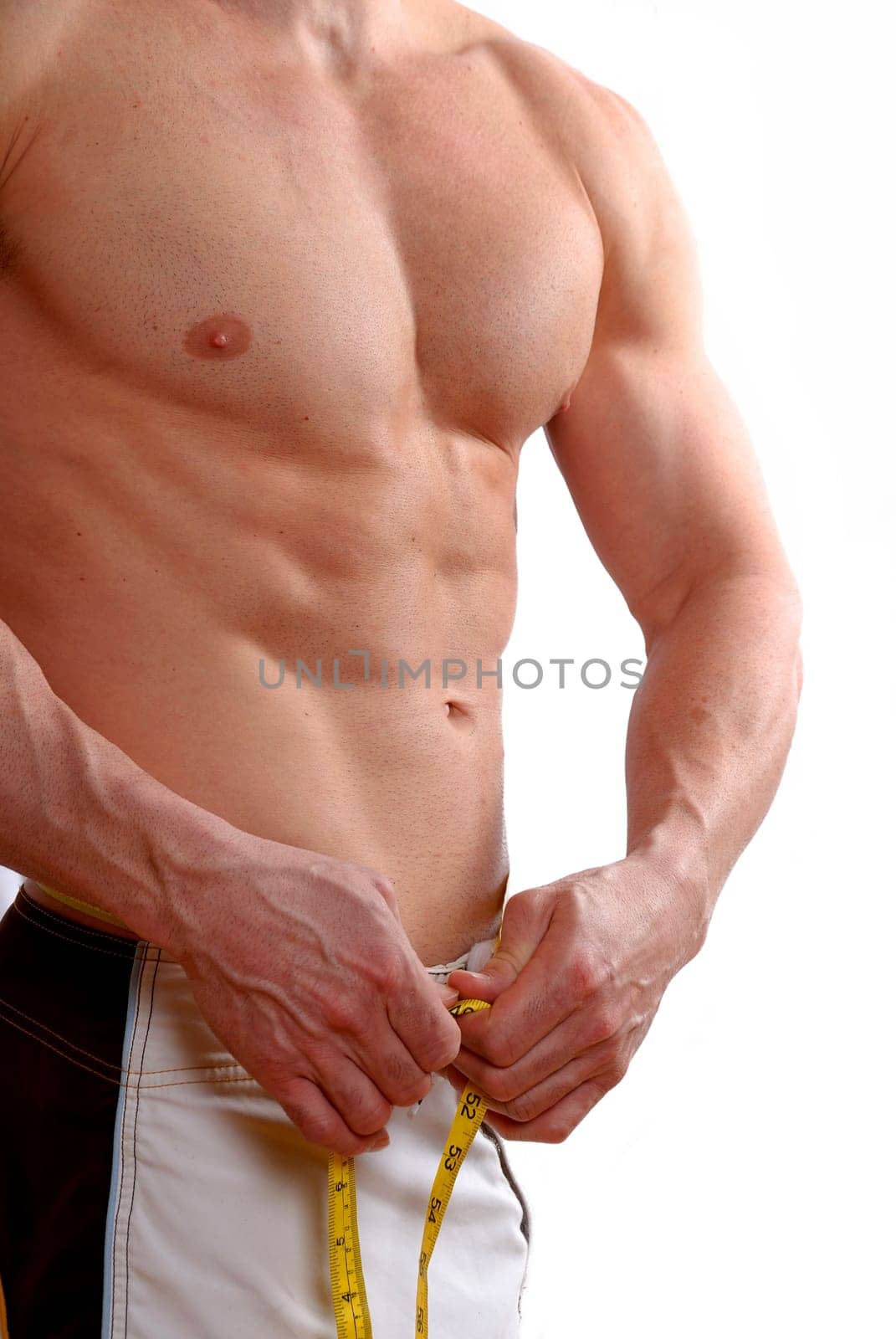 dieting man athlete topless with muscles on white