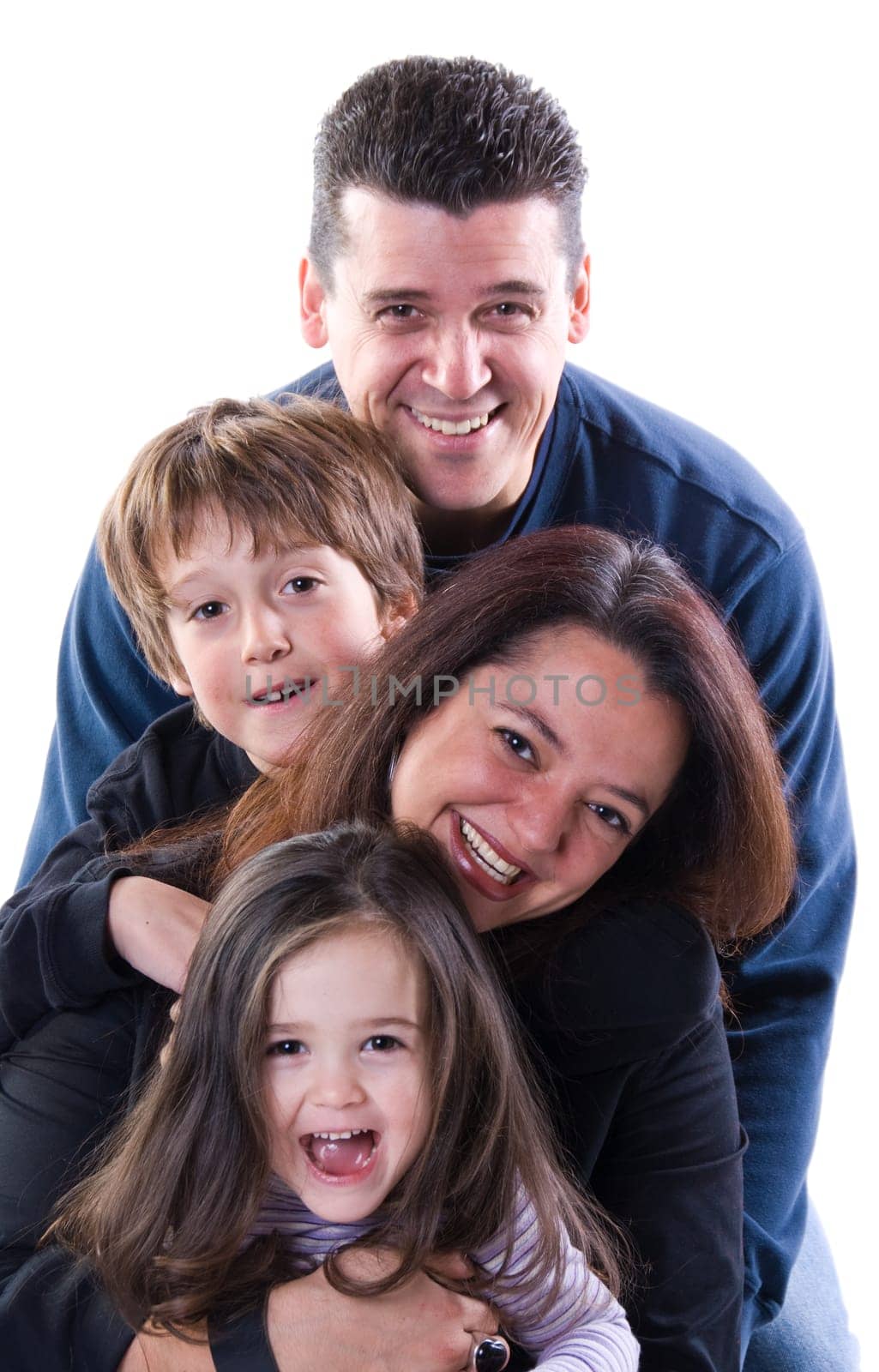 mom and dad with siblings on a white