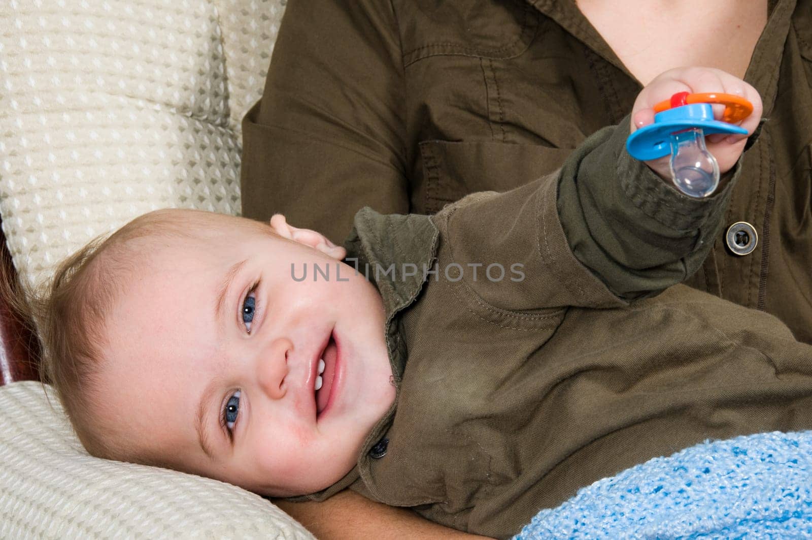 mom resting in a chair with her baby
