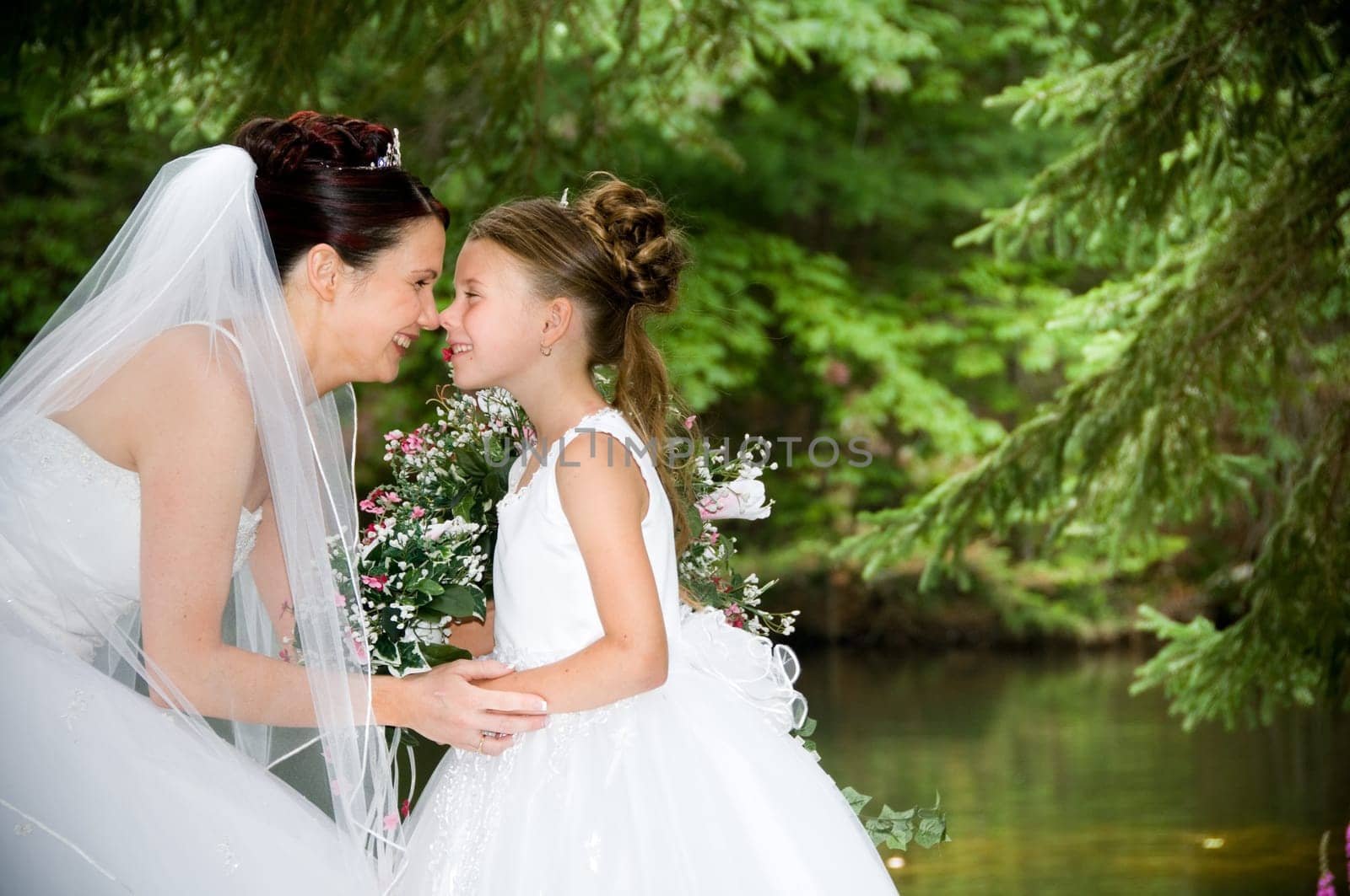 White Bride at her wedding posing with veil