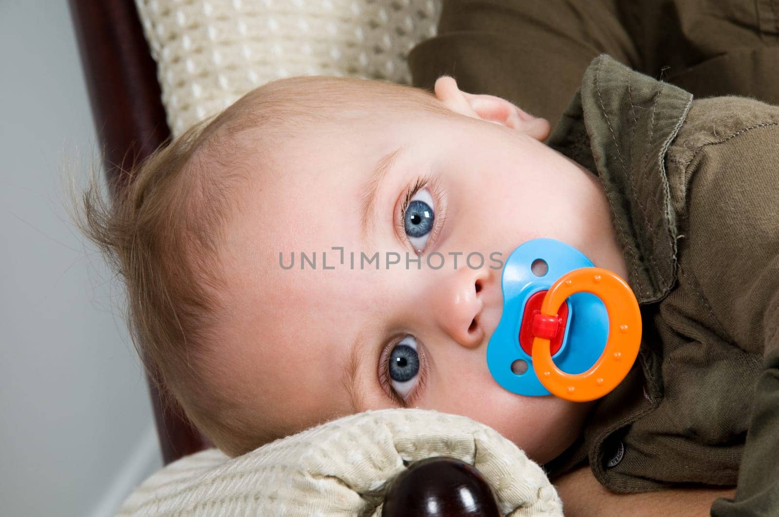 mom resting in a chair with her baby