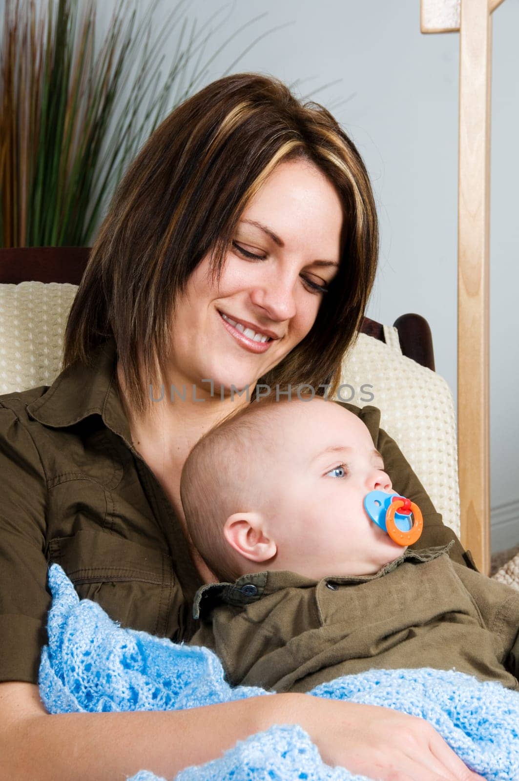 mom resting in a chair with her baby