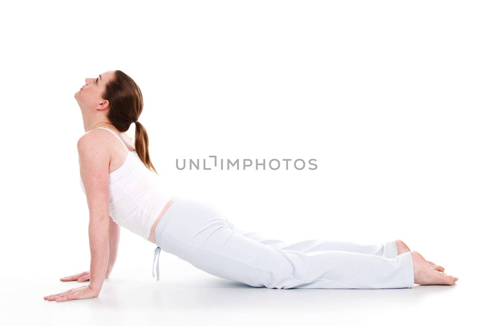 Beautiful woman doing yoga on isolated white background