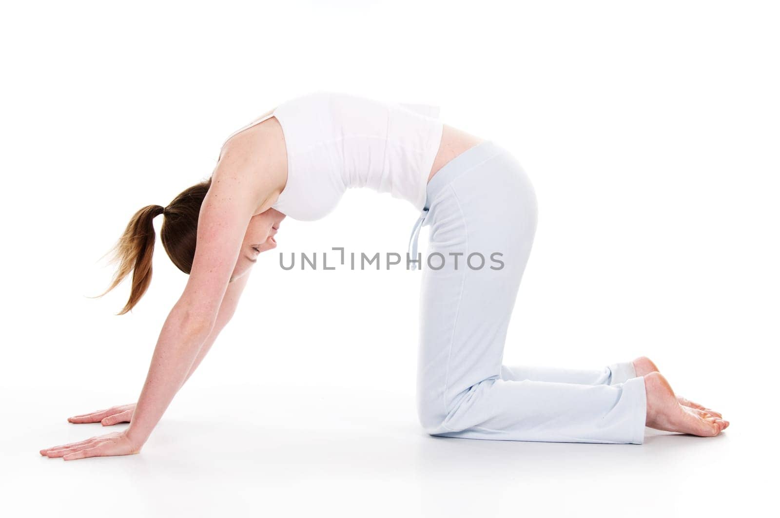 Beautiful woman doing yoga on isolated white background