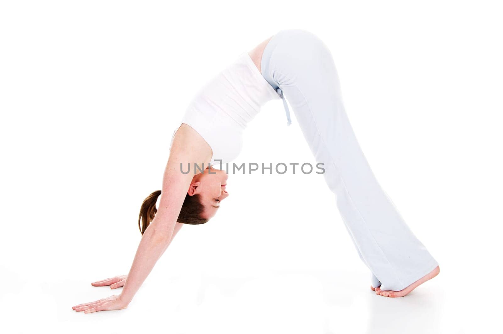 Beautiful woman doing yoga on isolated white background