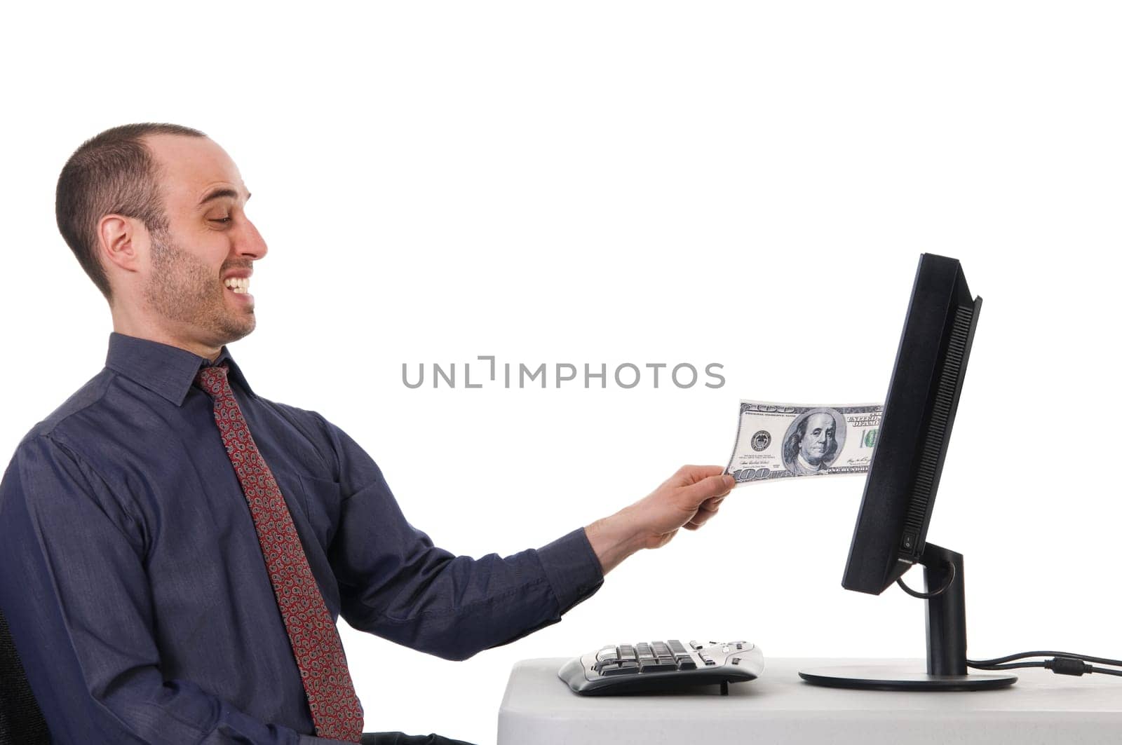 business man pulling his money from a monitor