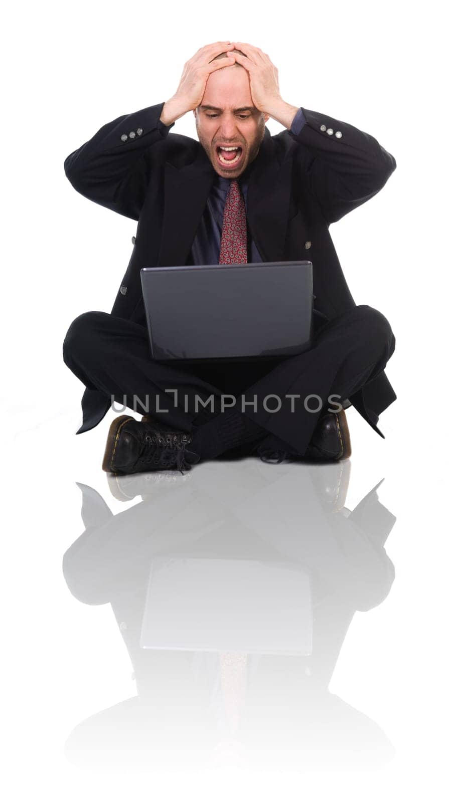 business man in a panic over the black laptop