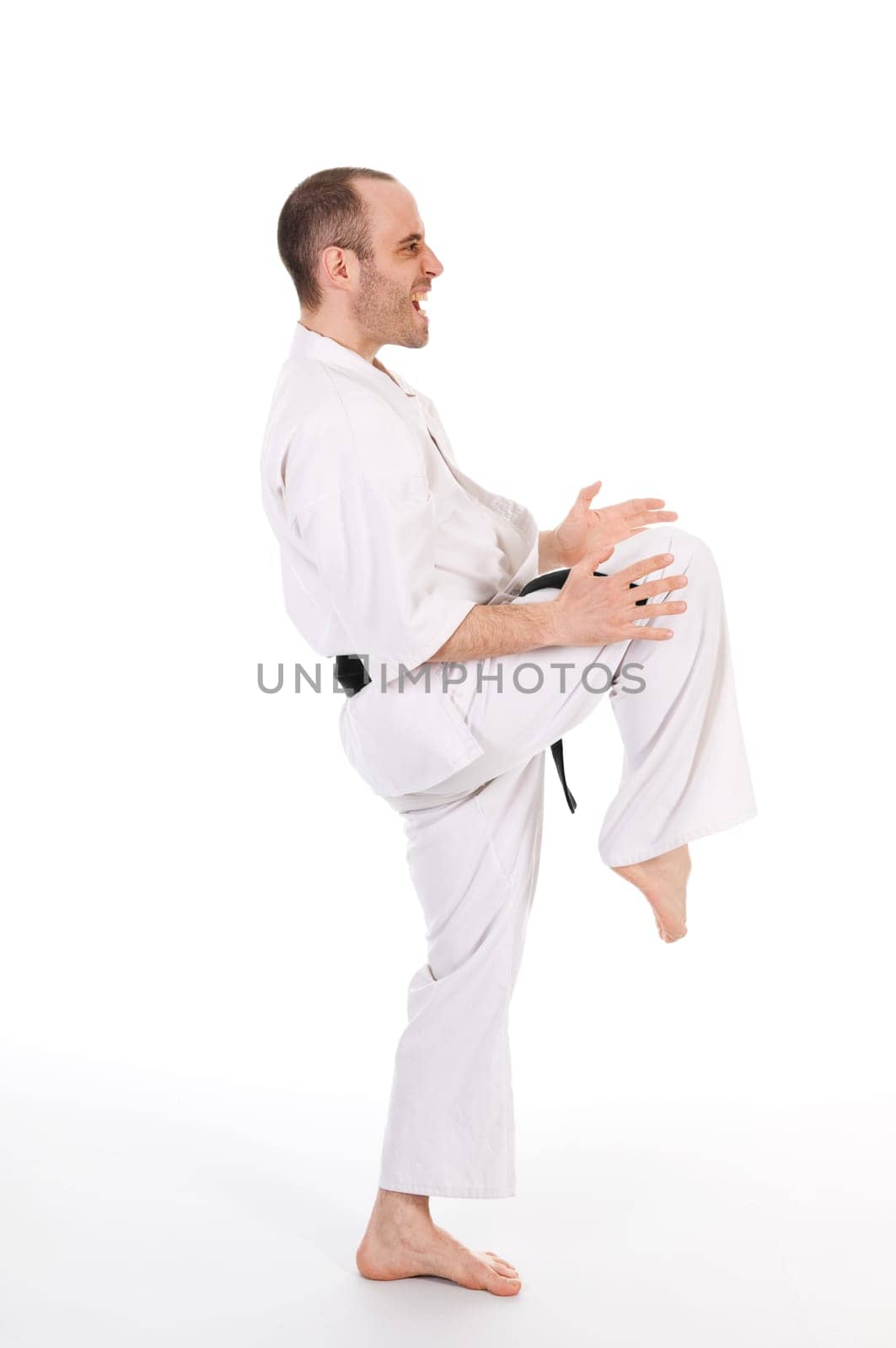 White man doing martial arts on isolated background