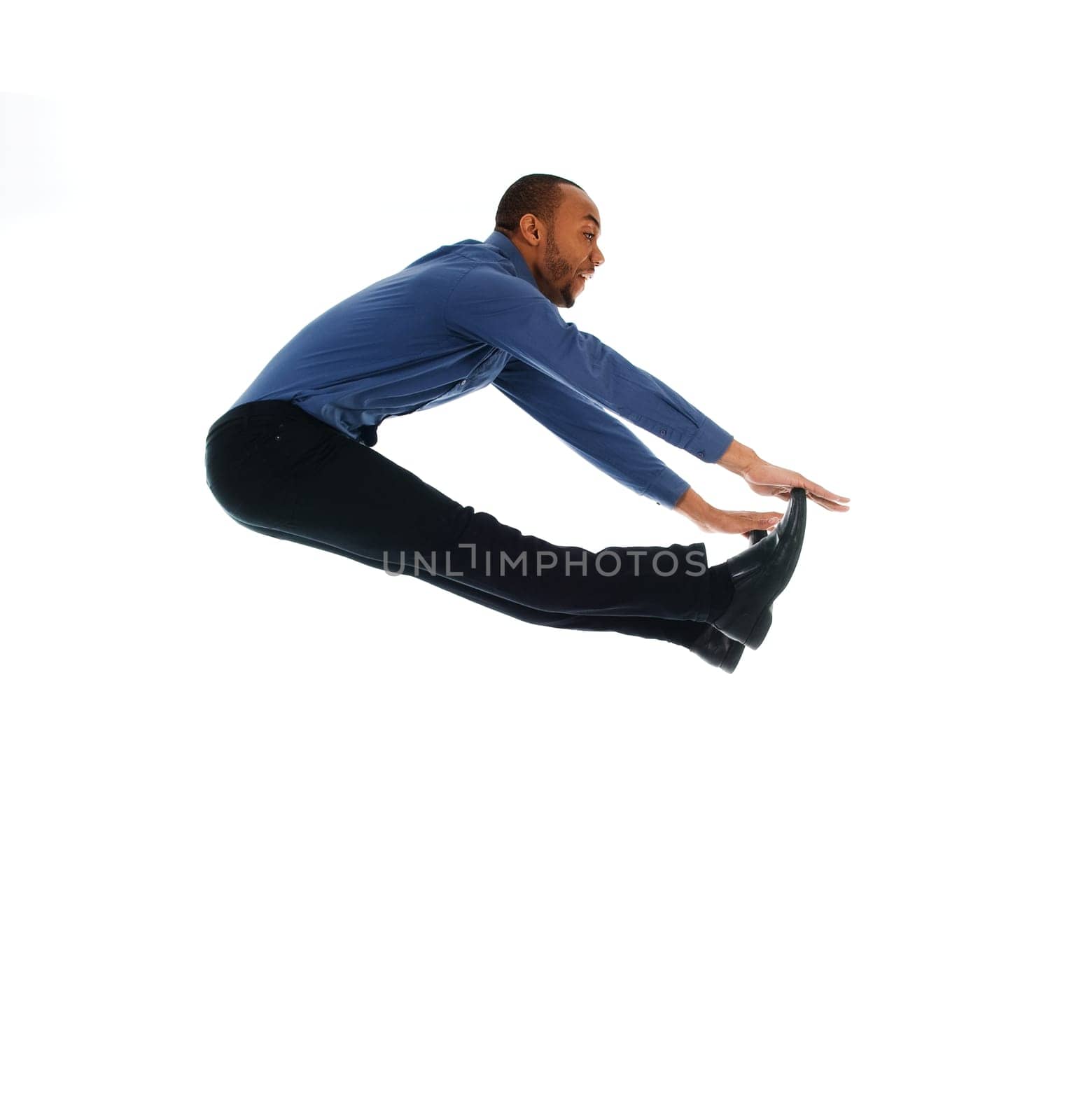 young attractive male dancer doing the jump