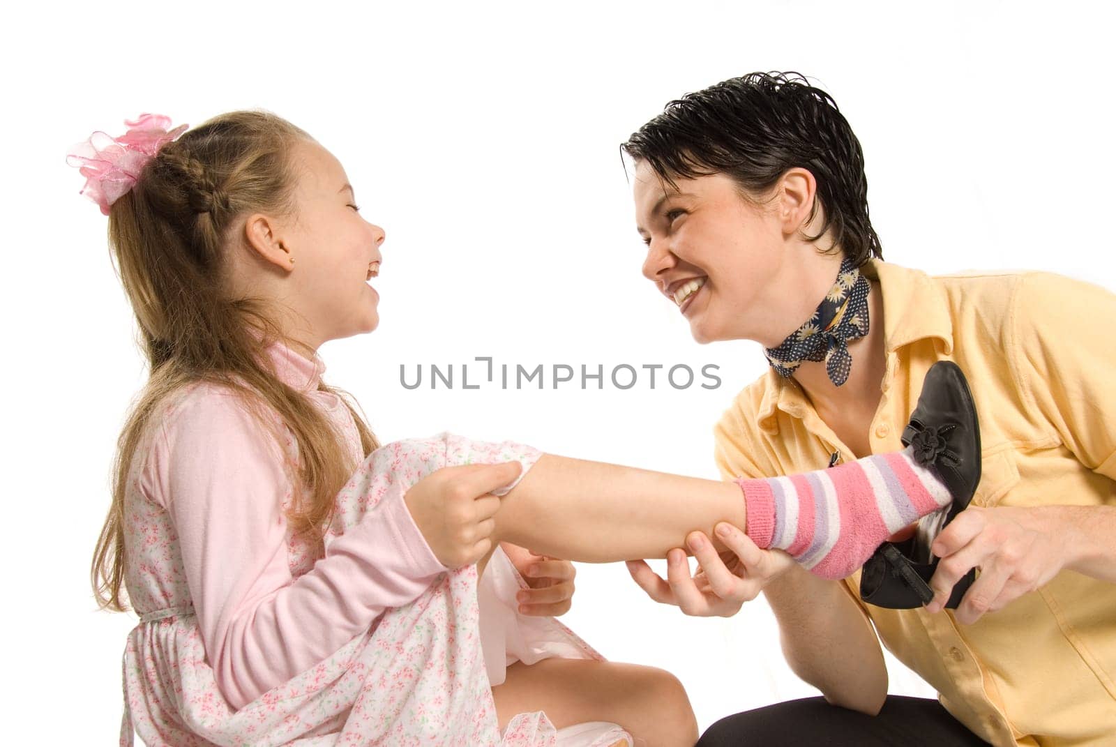 mom and daughter playing dress-up on white background