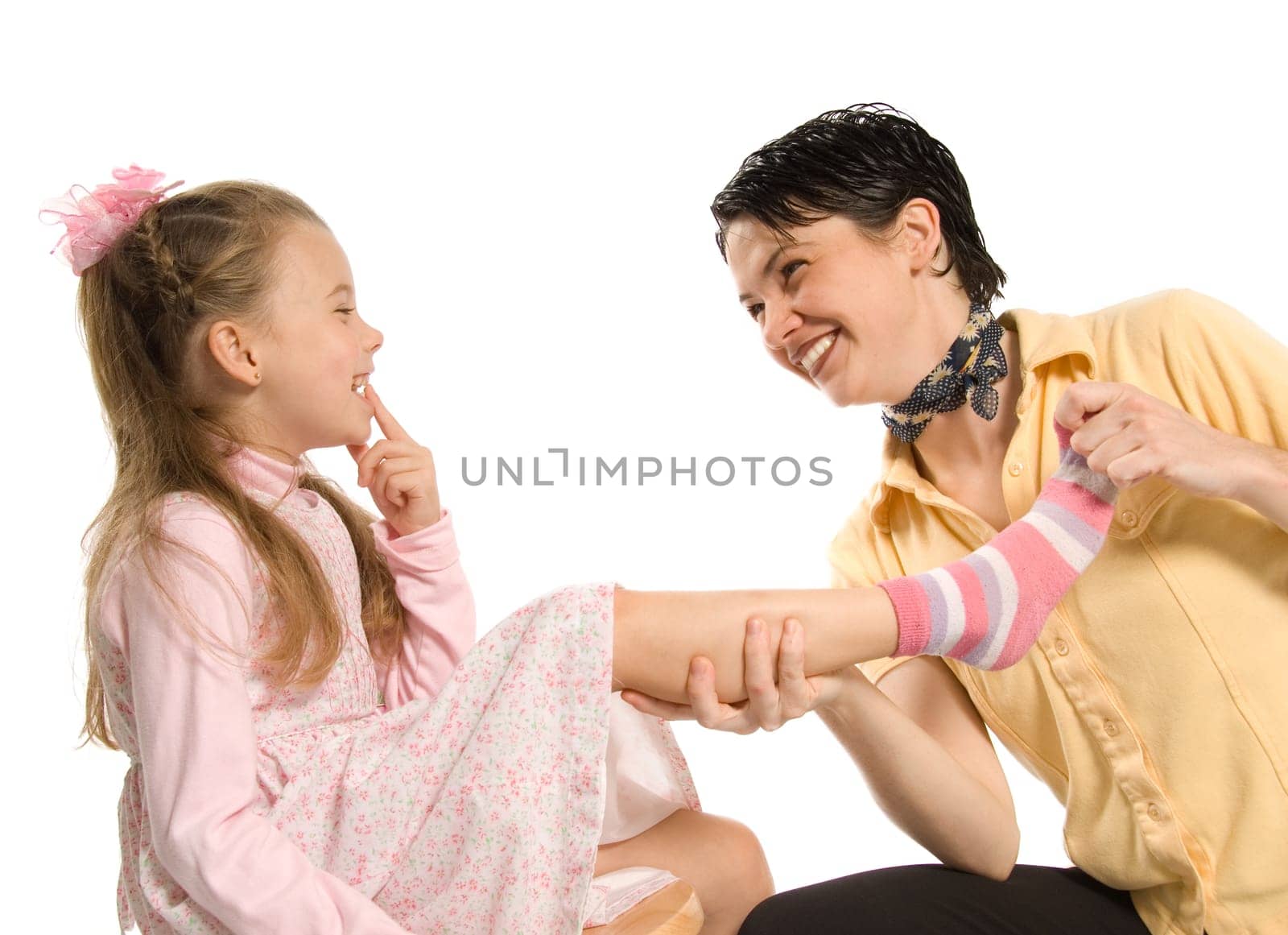 mom and daughter having fun plying dress-up
