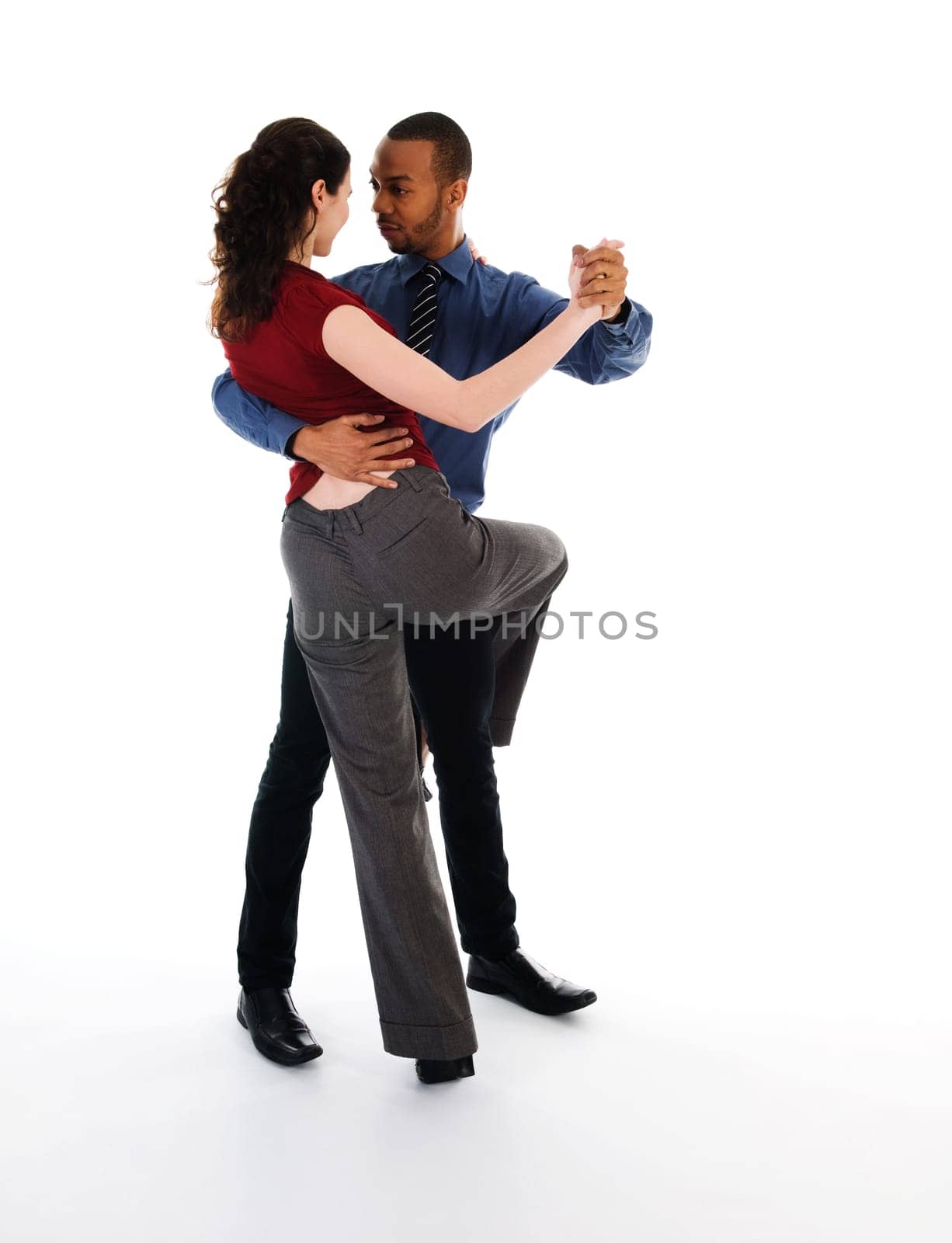 young multi ethnic couple beautiful dancing on white