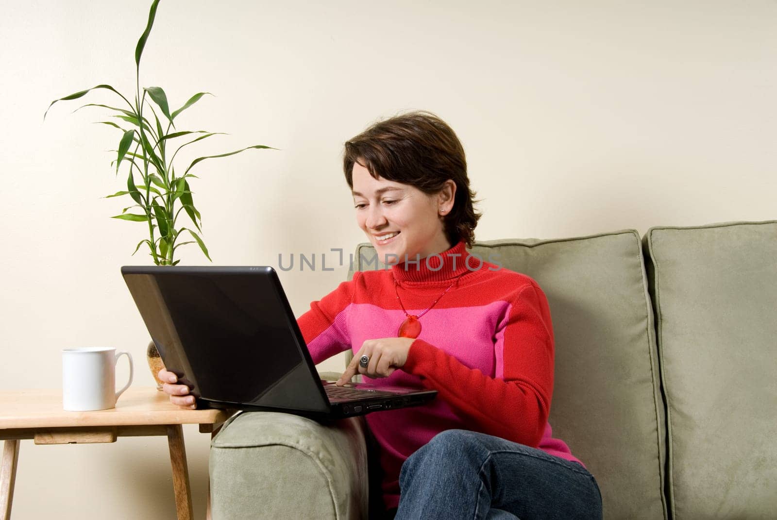 woman on laptop computer on couch