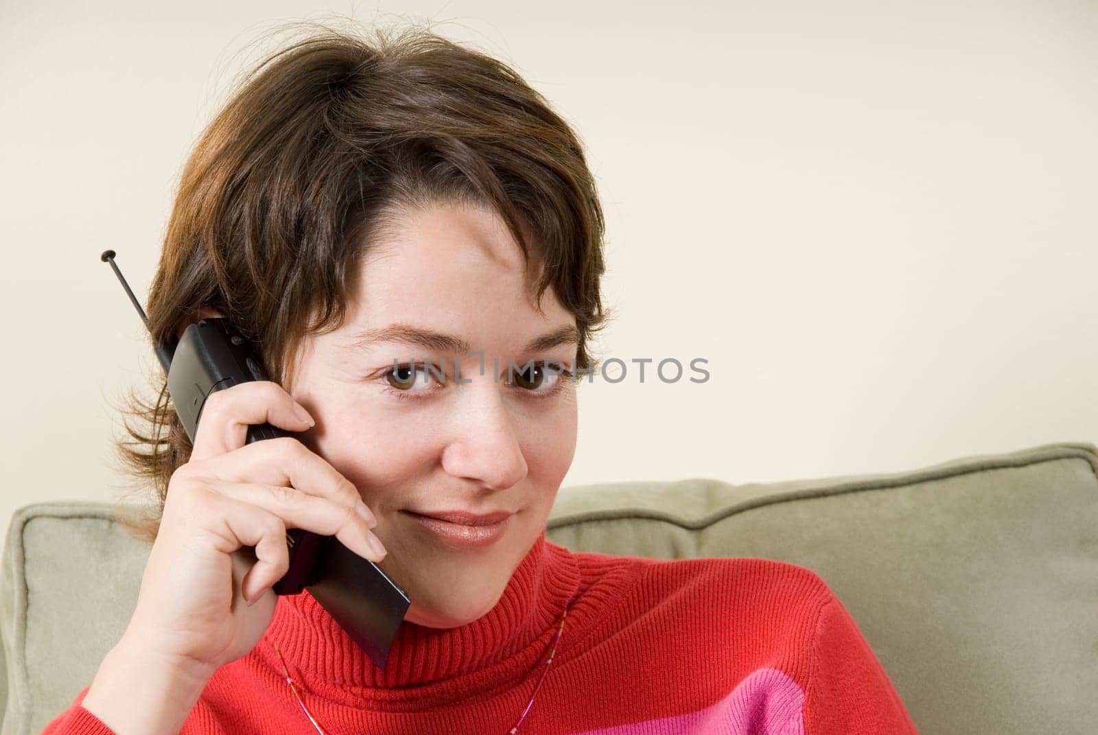 woman on the phone staring seductively at camera