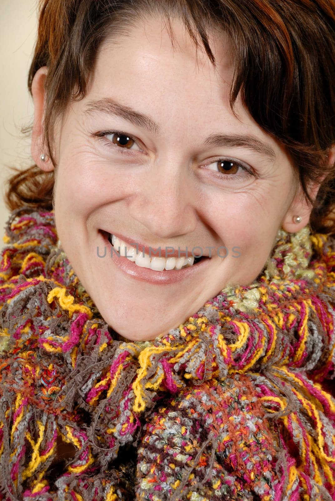 happy woman with very colorful scarf portrait