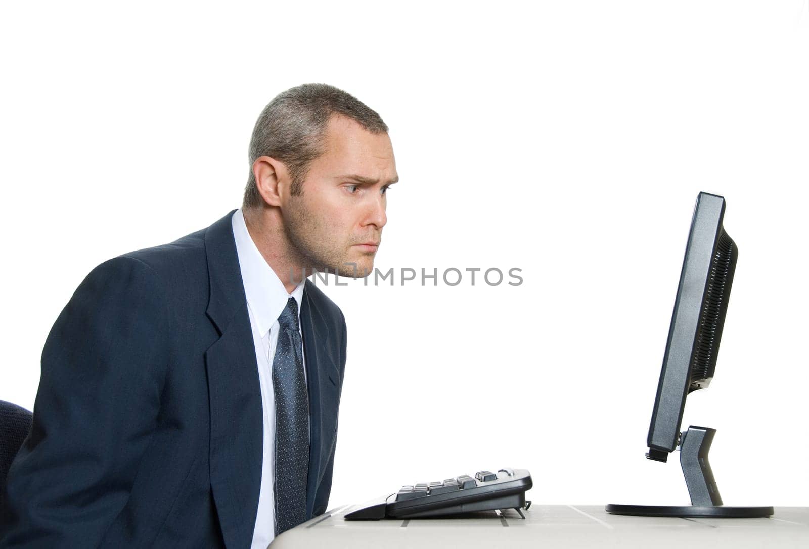 man in blue suit looking at lcd monitor