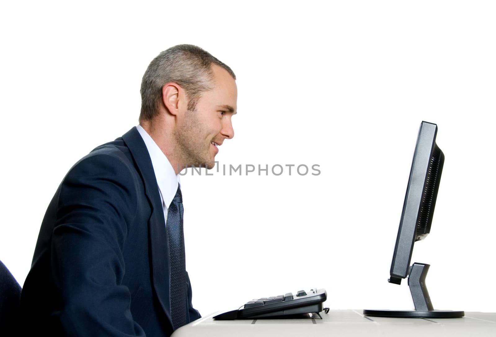 happy man in blue suit in front of computer