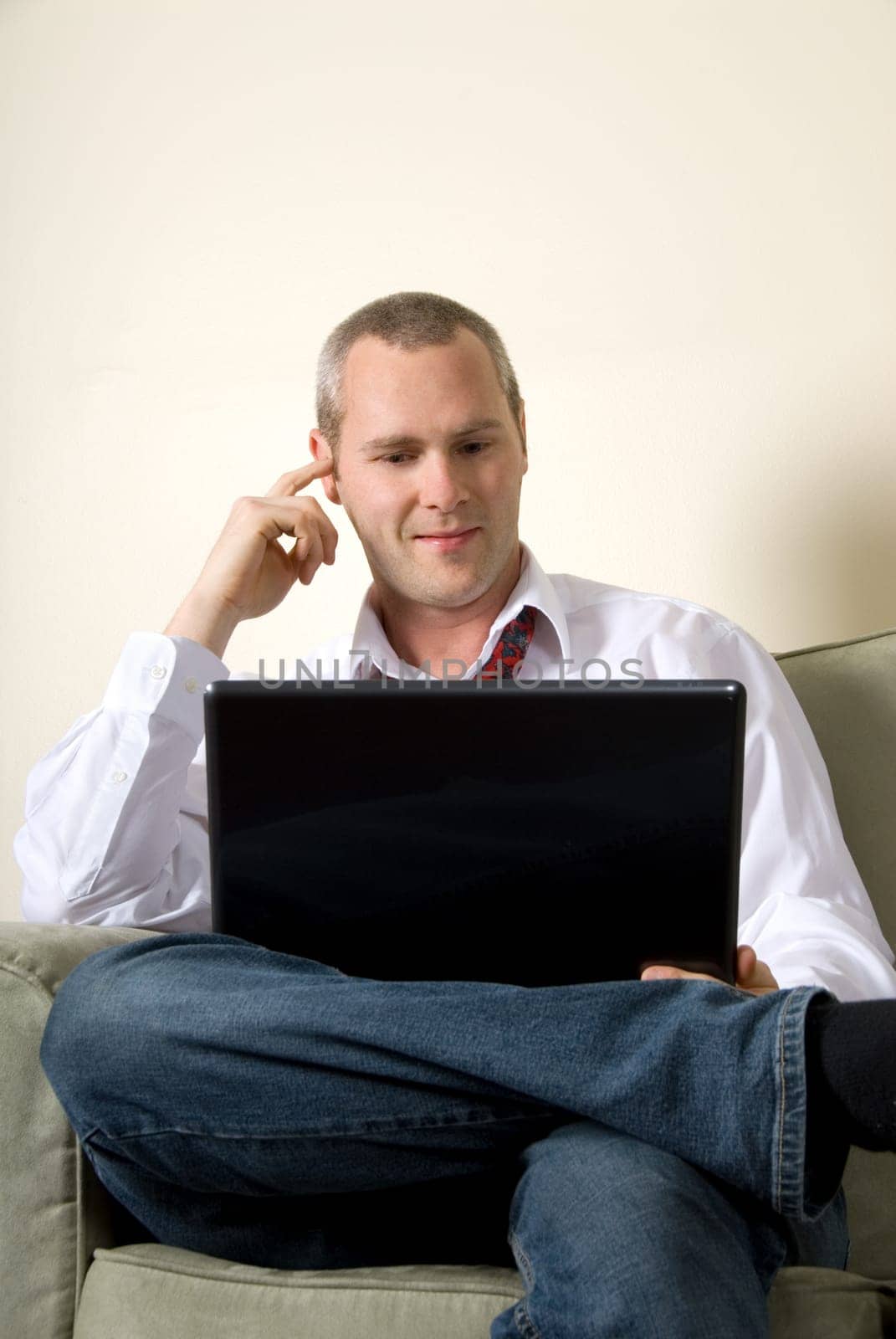 businessman looking at emails on his laptop