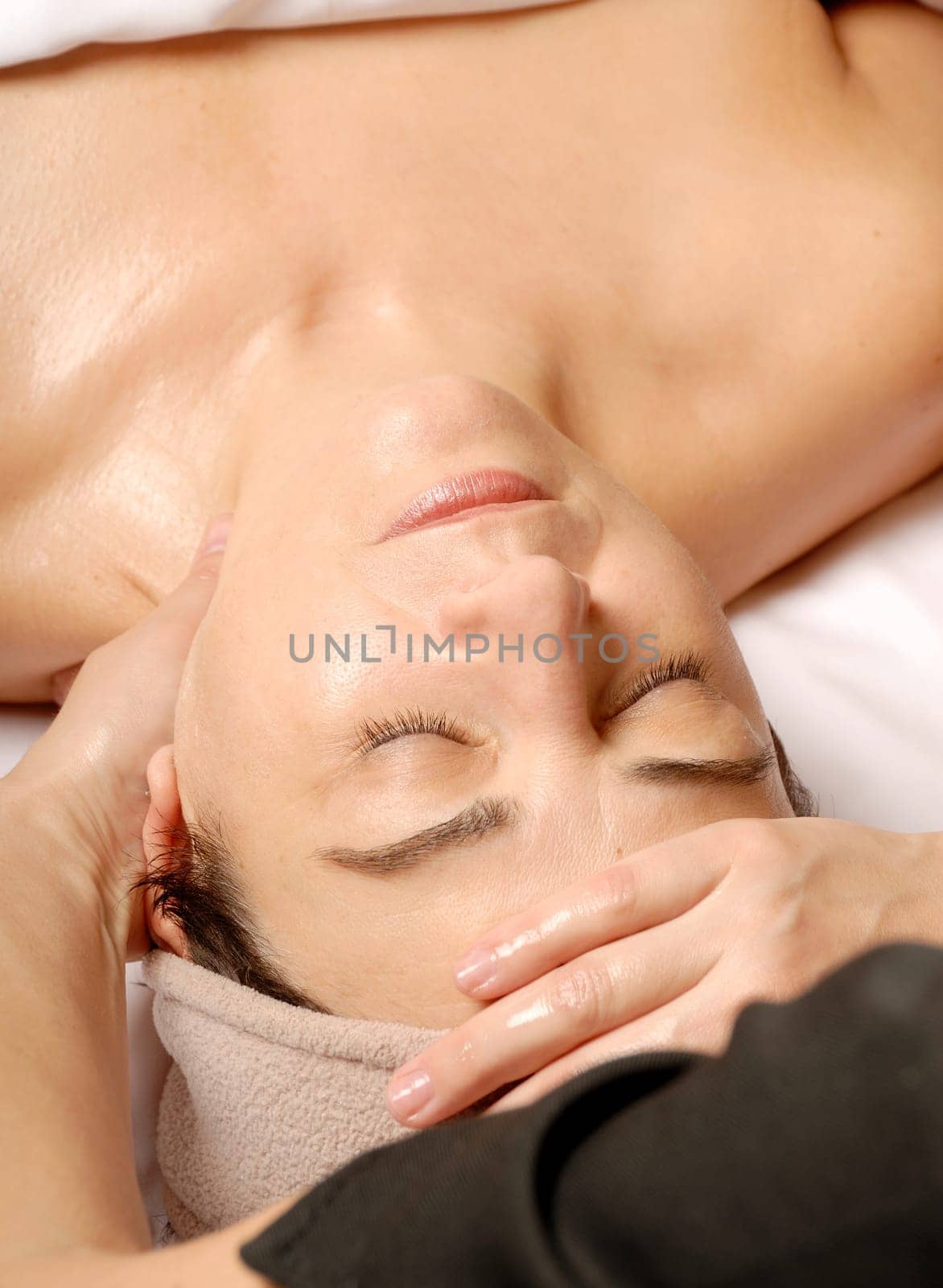 woman in a spa getting a facial