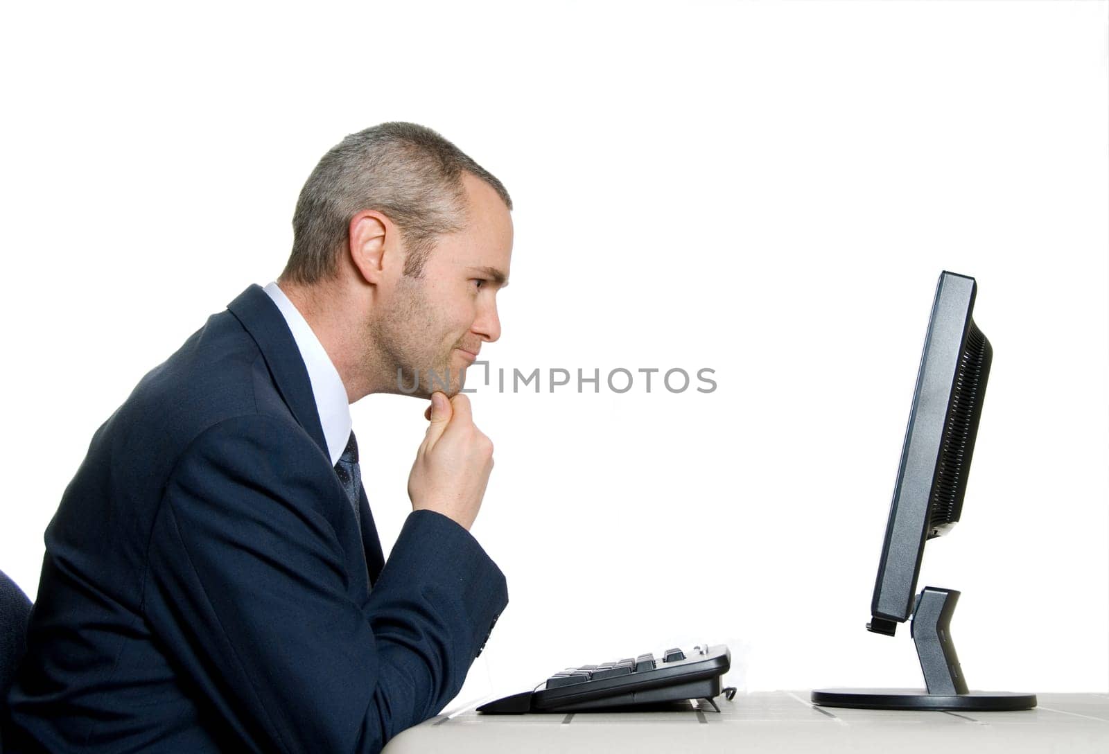 man in blue suit with tie analyzing lcd screen