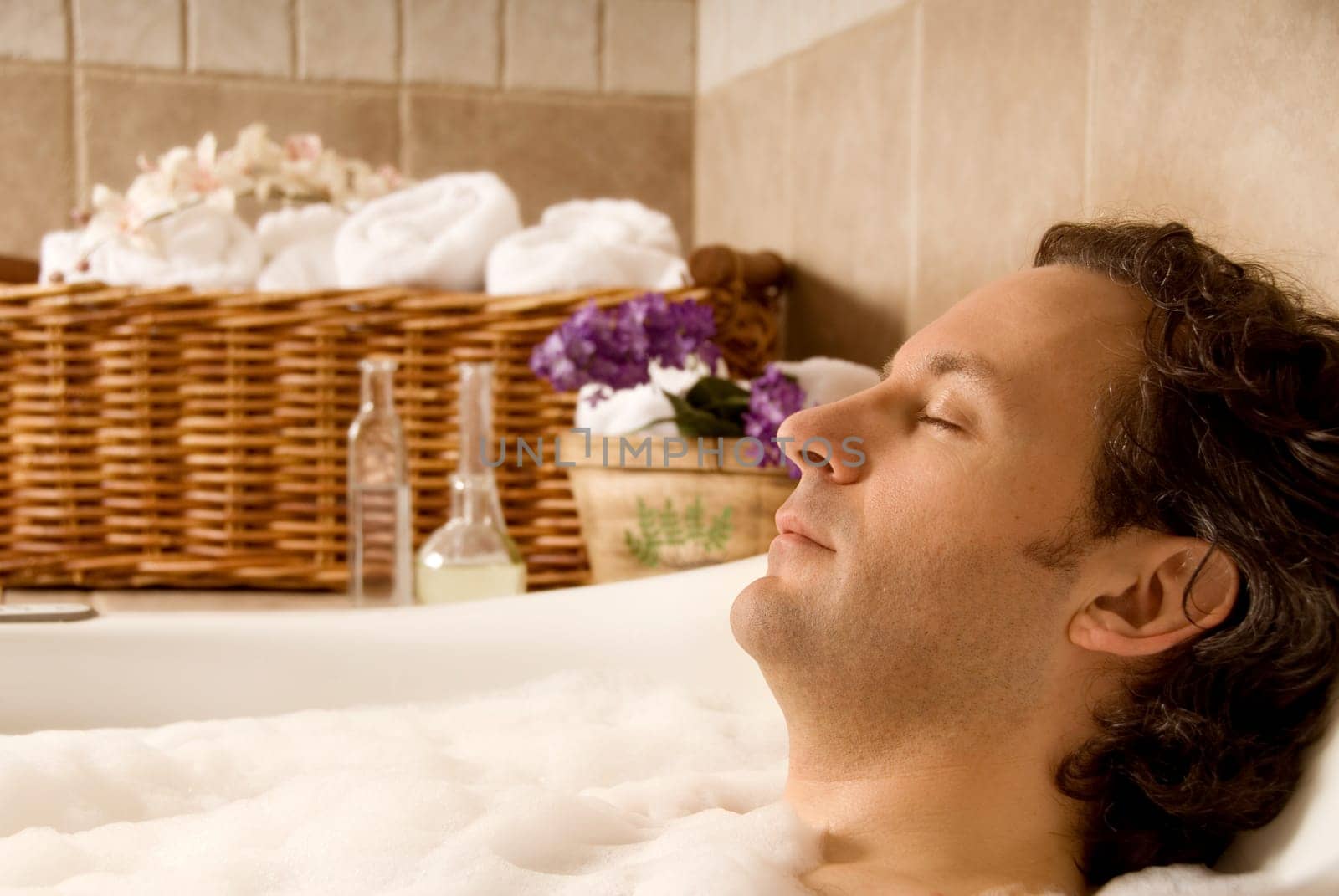 man client in a spa taking an aroma bath