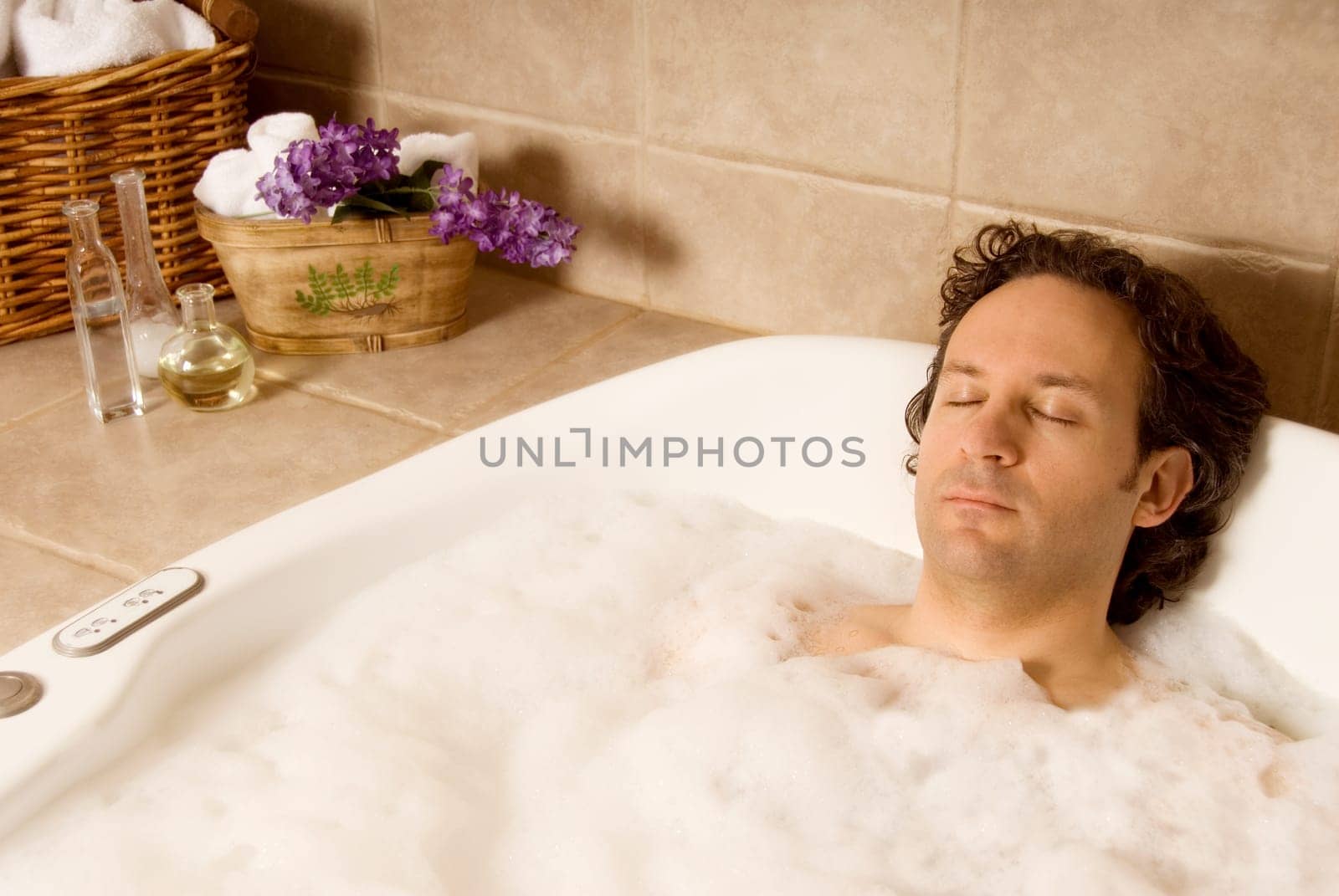 man client getting a bubble bath at spa