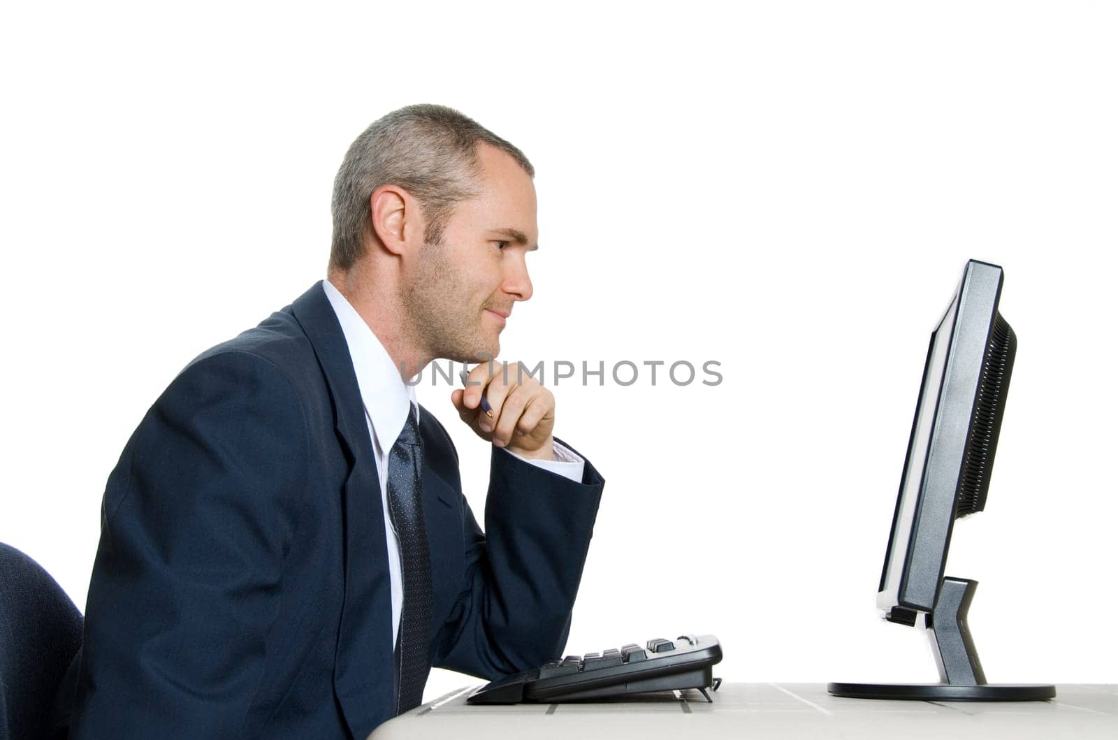 man in blue suit looking at lcd monitor