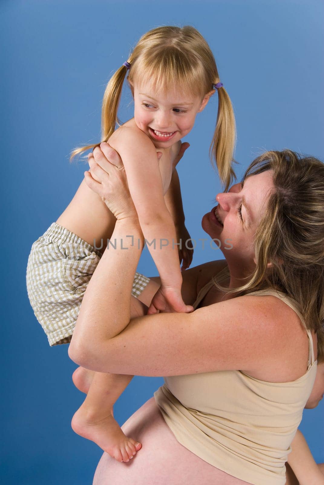 mother and her kid playing in the air