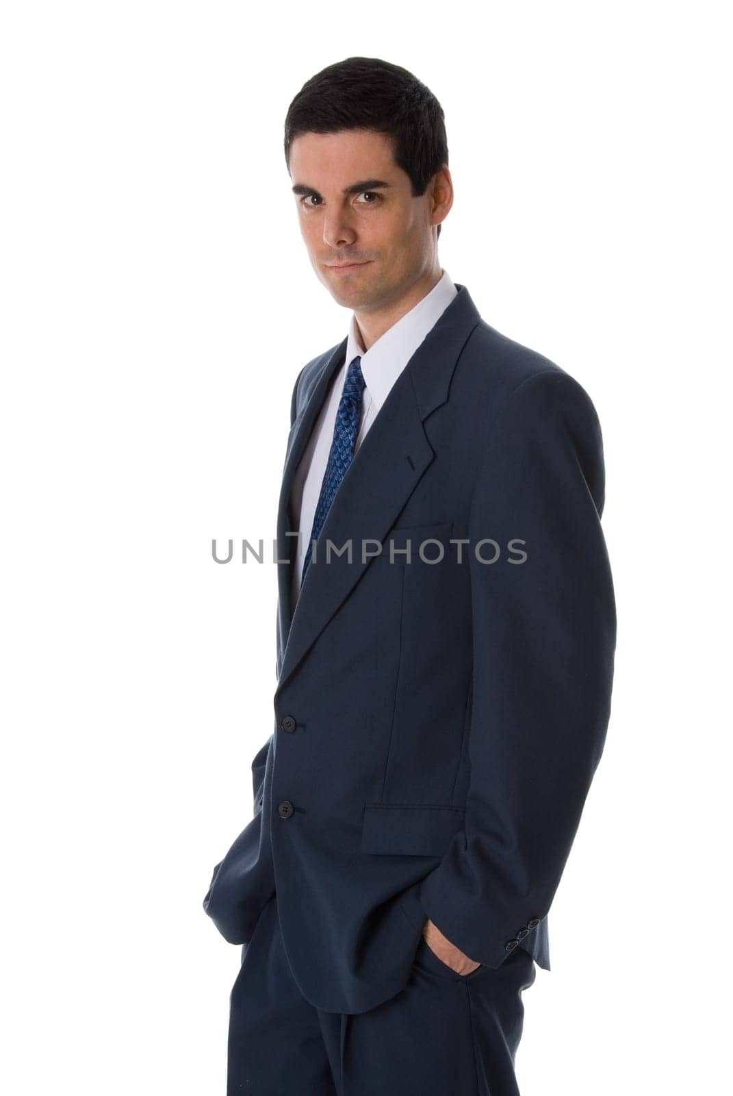 businessman in blue suit with his hands in his pockets